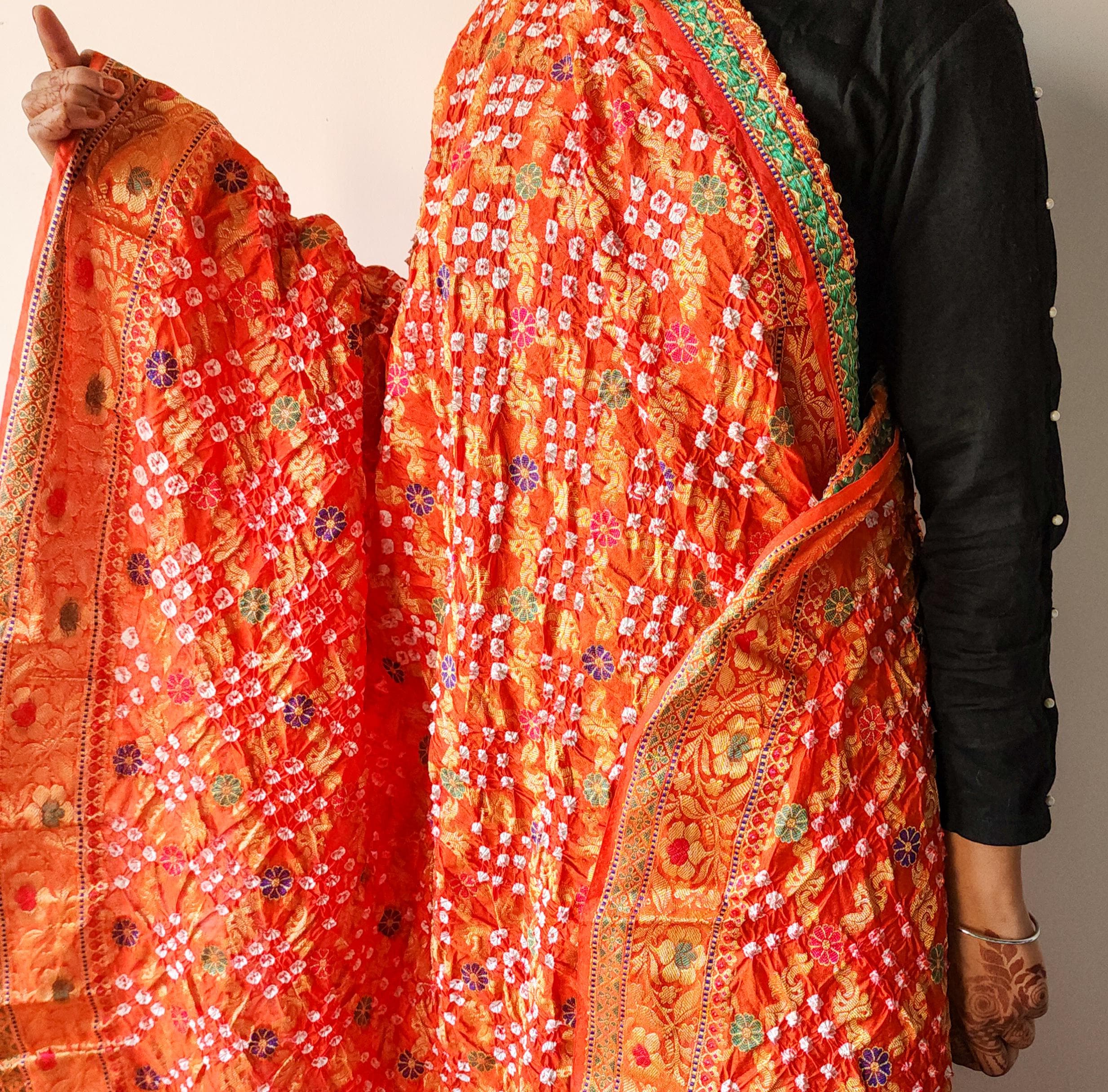Orange Bandhni dupatta with Banarasi Meenakari work