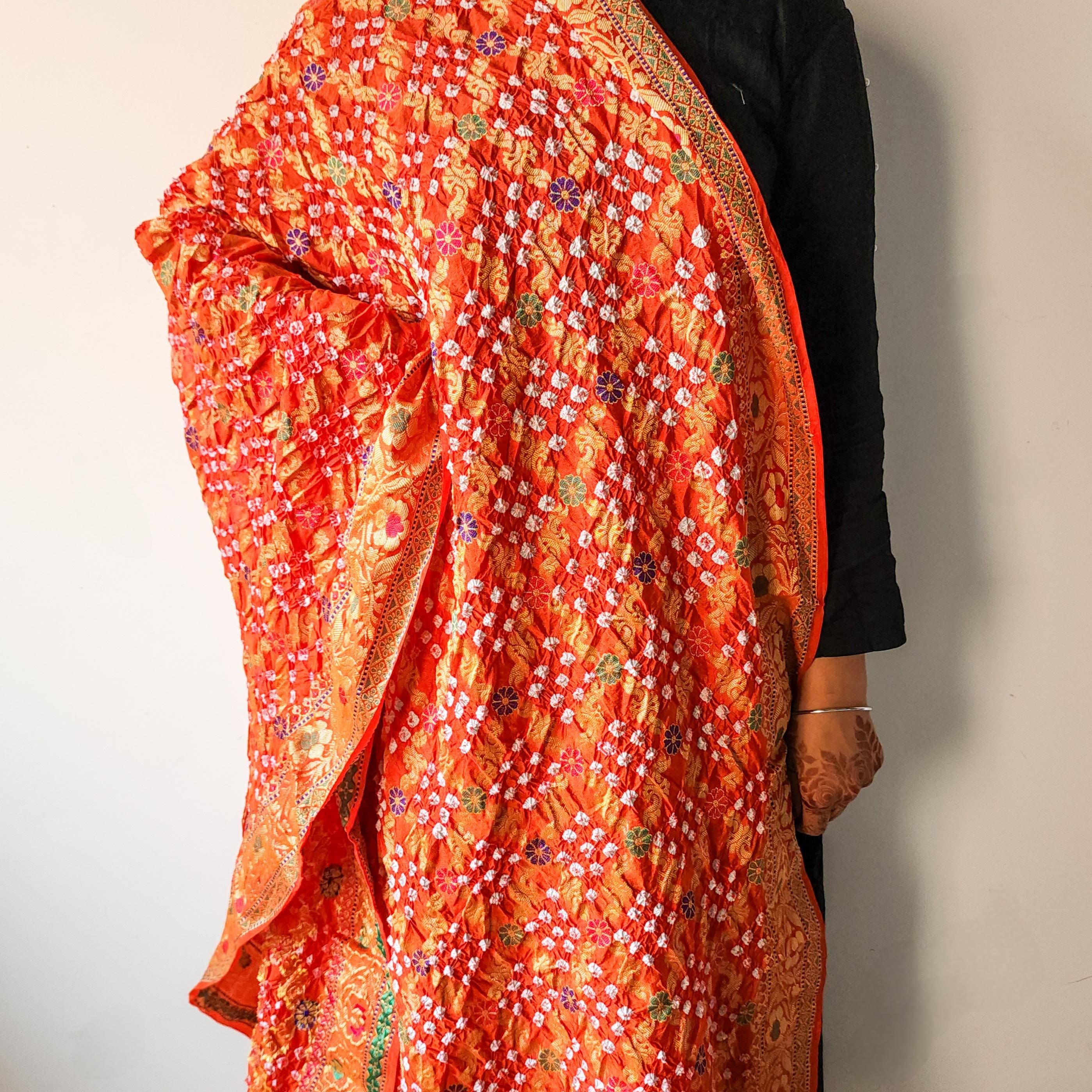 Orange Bandhni dupatta with Banarasi Meenakari work