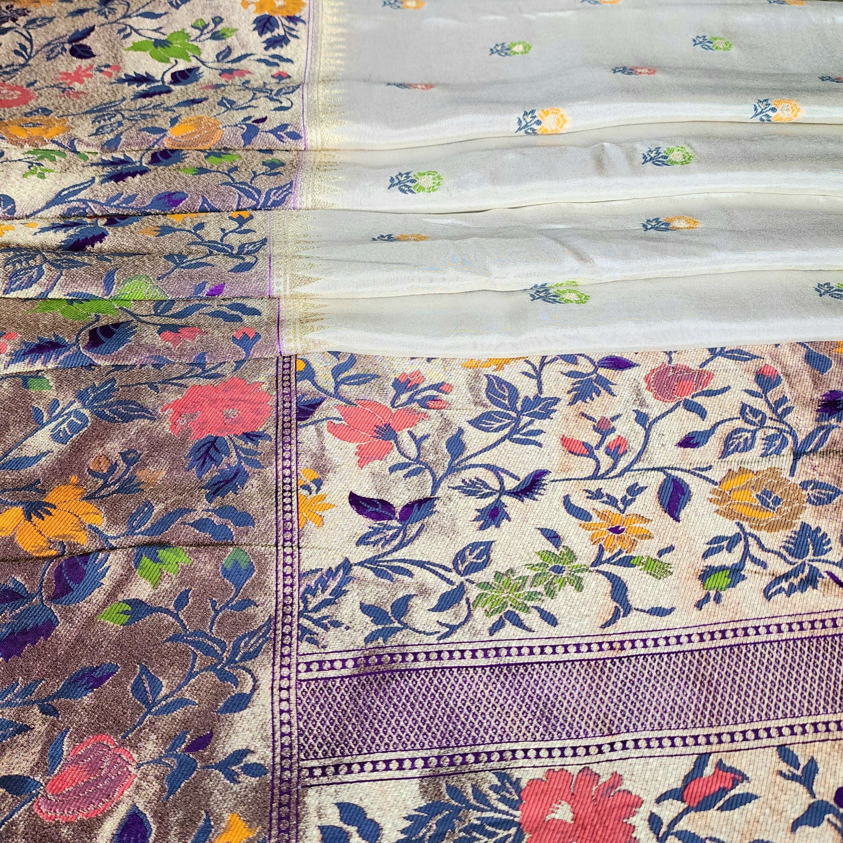 Soft Ivory Raw Silk Saree With Pastel Floral Weaving and Lilac Purple Border