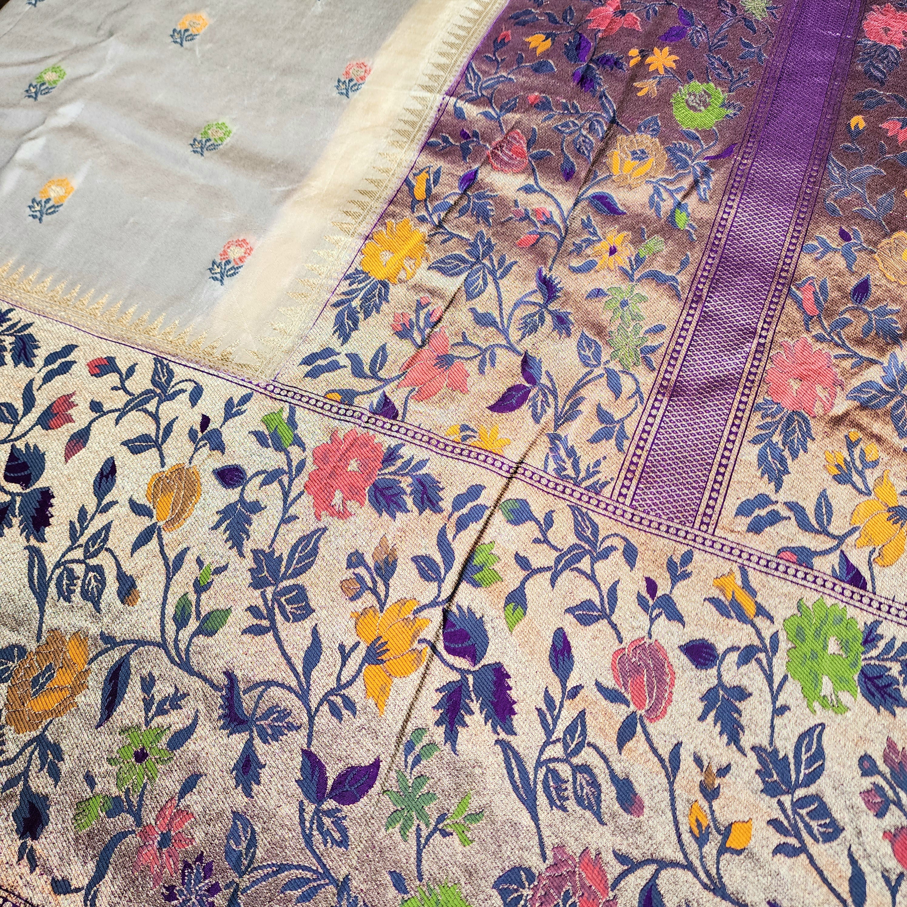 Soft Ivory Raw Silk Saree With Pastel Floral Weaving and Lilac Purple Border