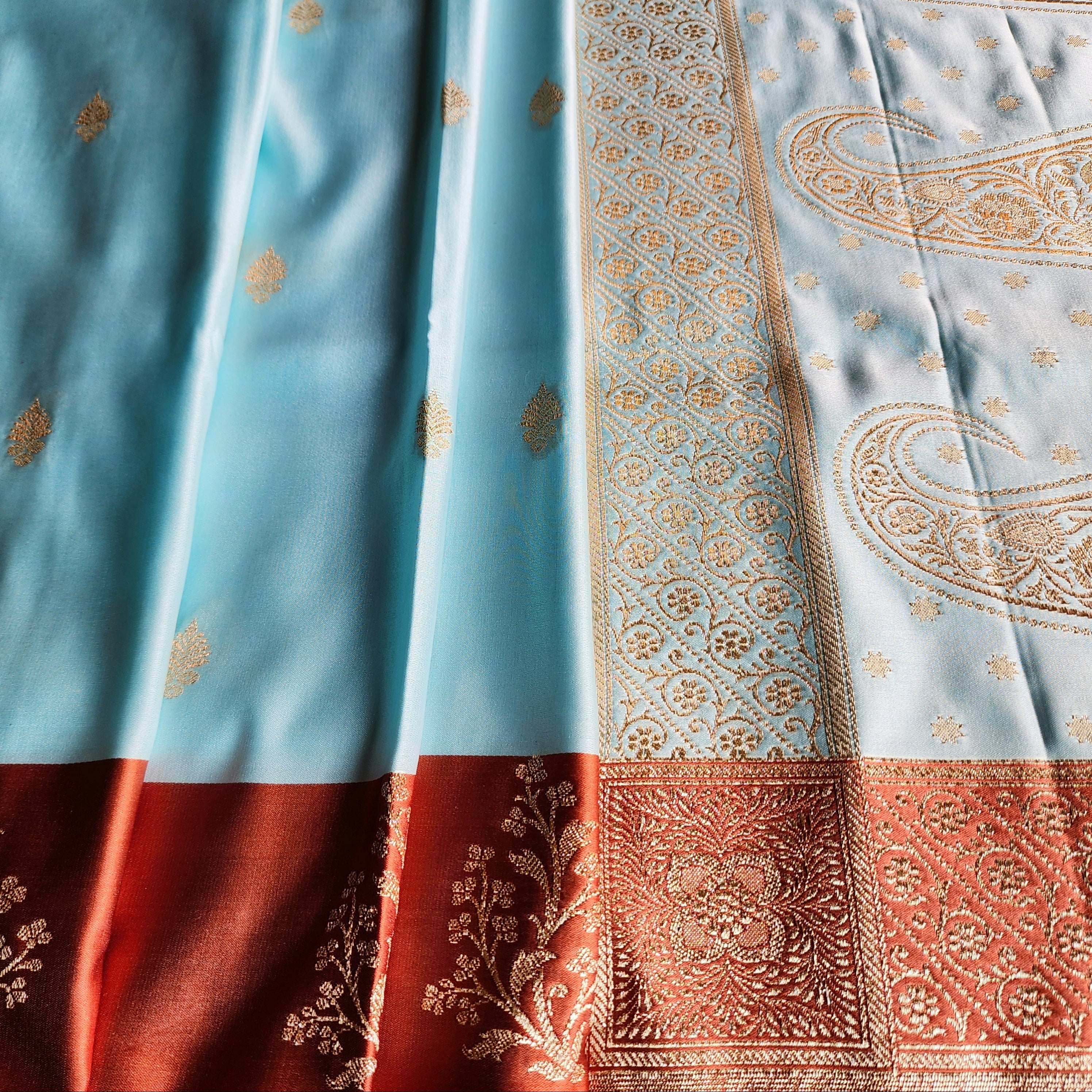 Powder Blue Katan Silk Saree with Rust Orange Gold Zari Border