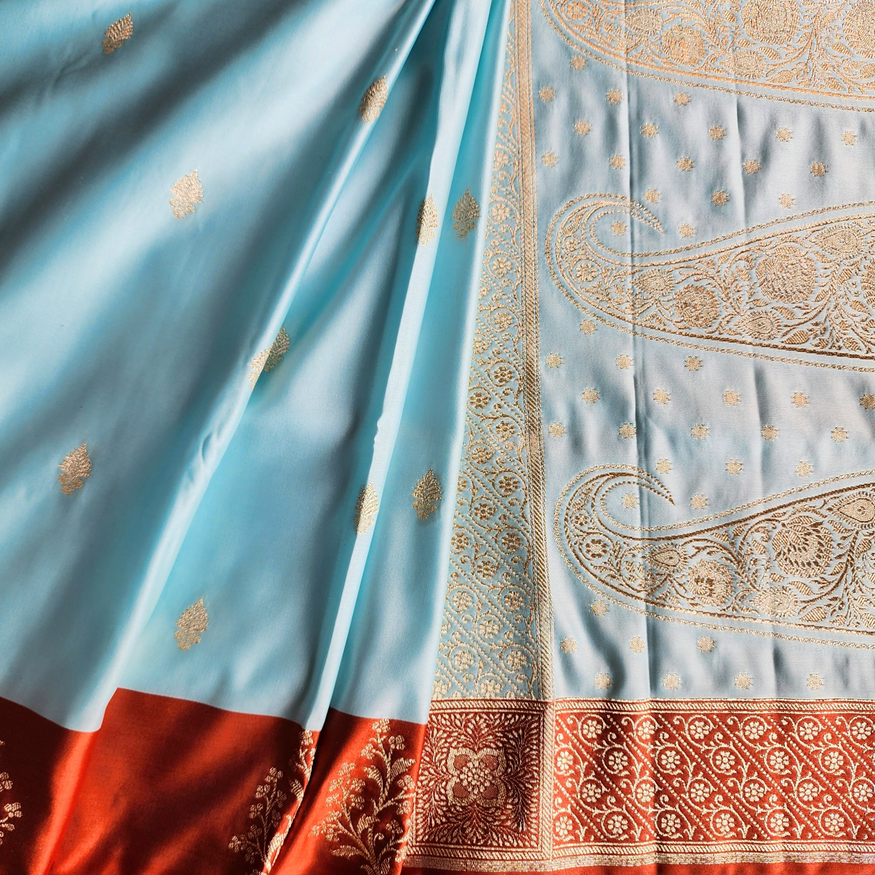Powder Blue Katan Silk Saree with Rust Orange Gold Zari Border