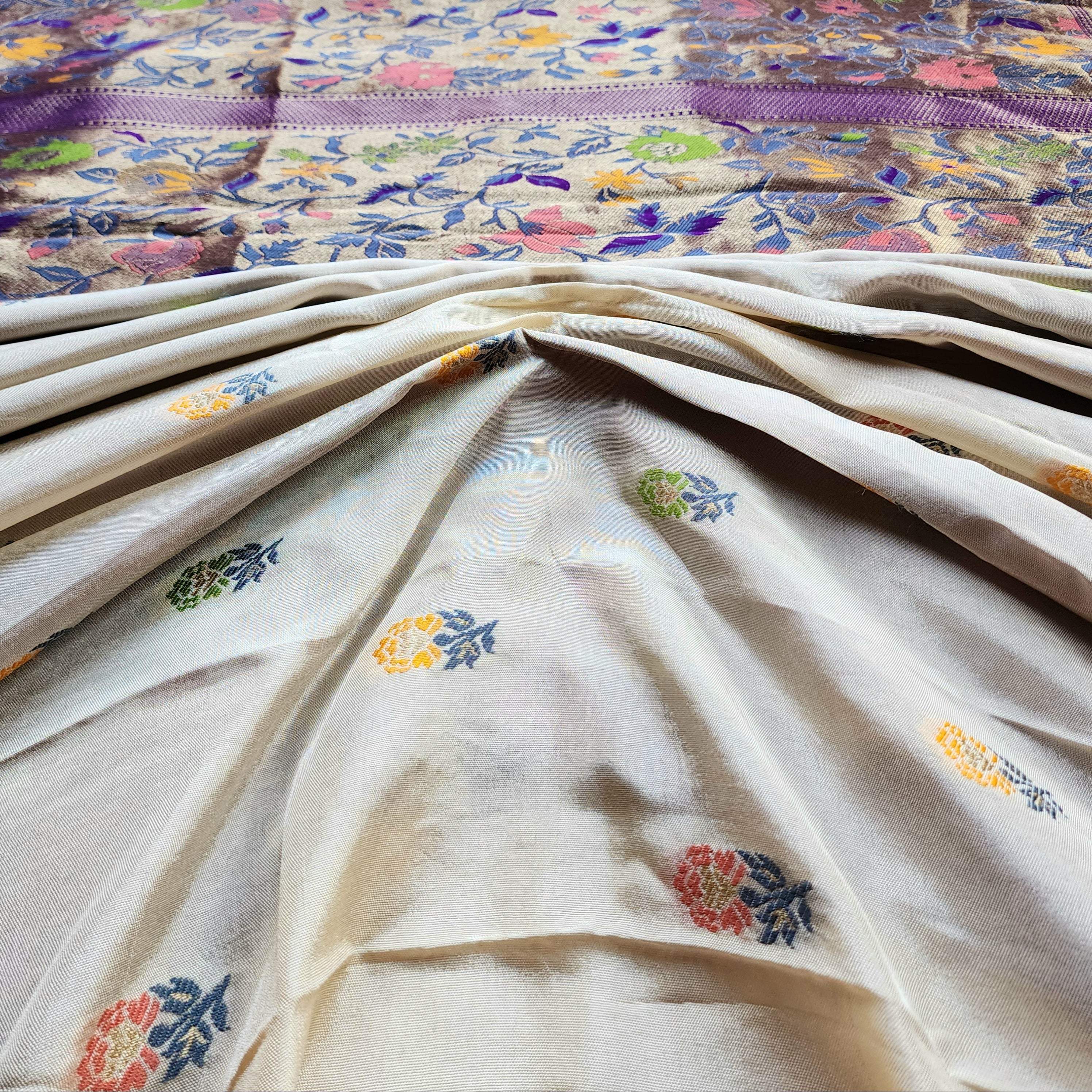 Soft Ivory Raw Silk Saree With Pastel Floral Weaving and Lilac Purple Border