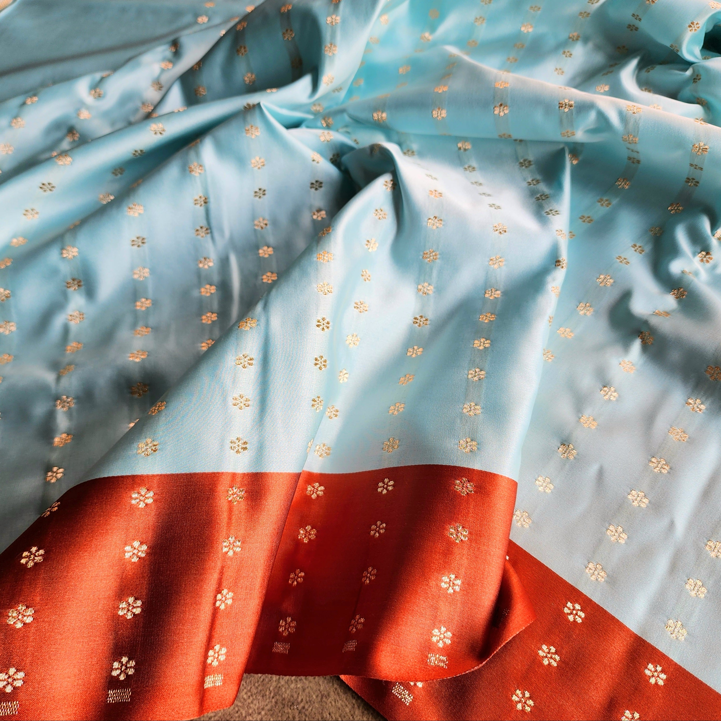 Powder Blue Katan Silk Saree with Rust Orange Silver Zari Border