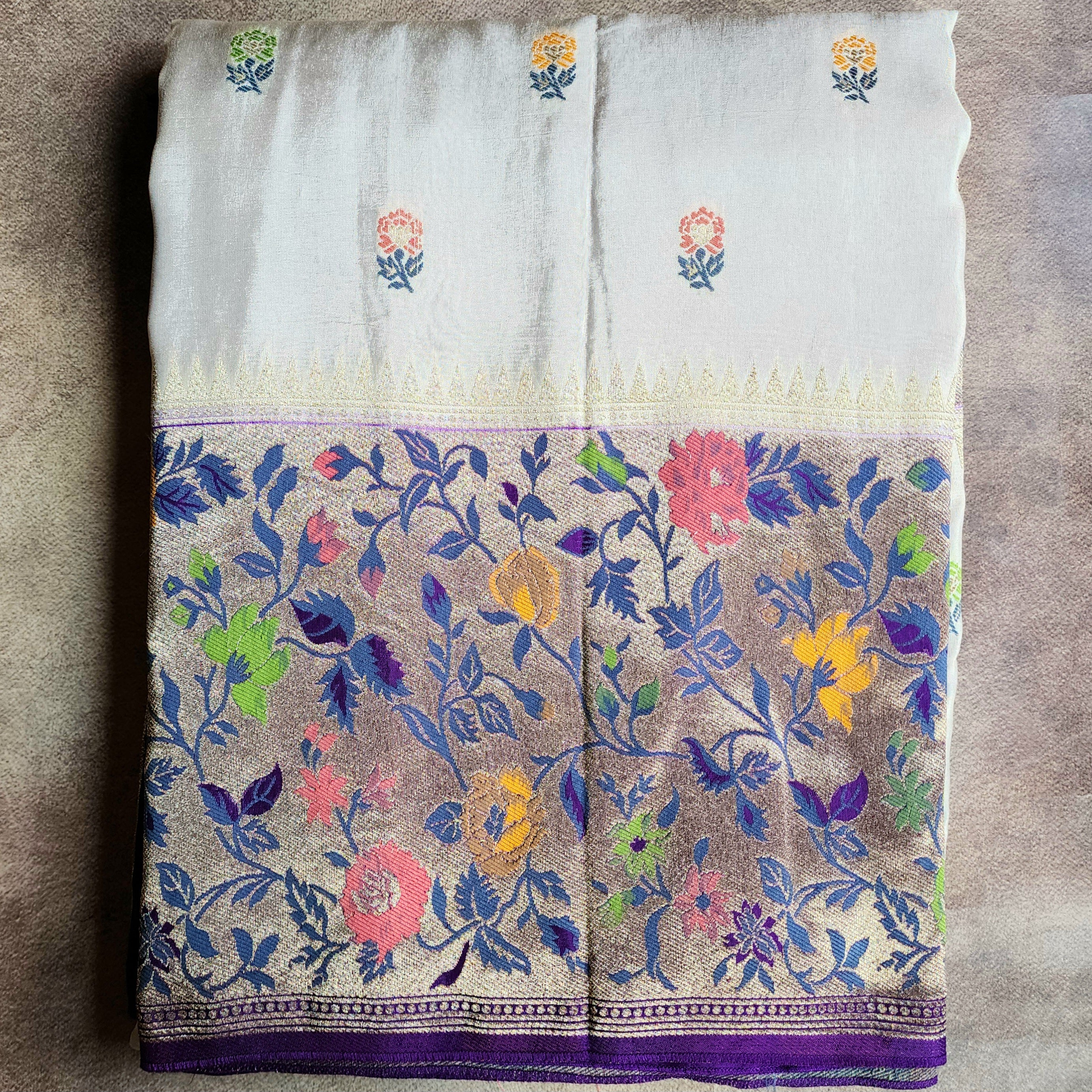 Soft Ivory Raw Silk Saree With Pastel Floral Weaving and Lilac Purple Border