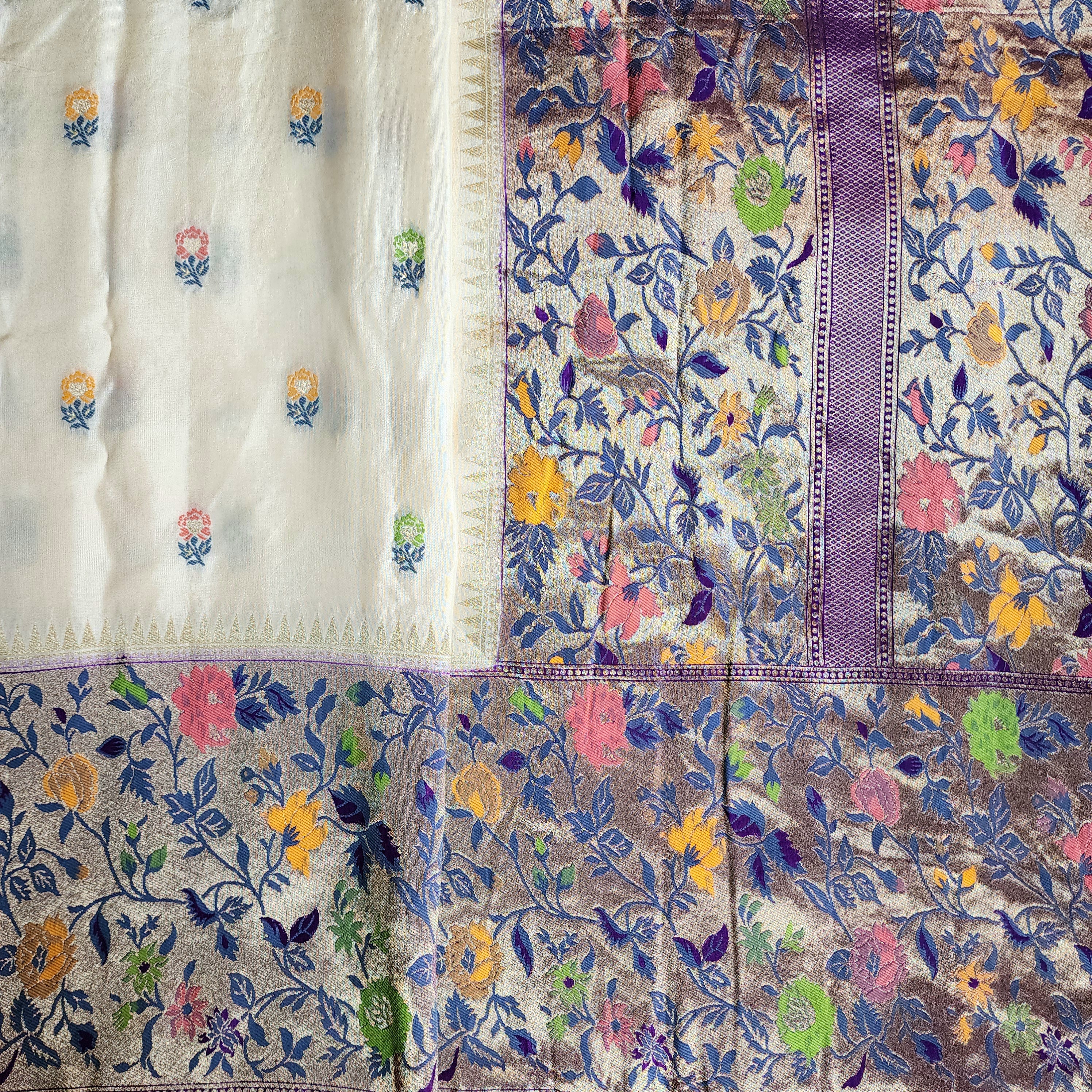 Soft Ivory Raw Silk Saree With Pastel Floral Weaving and Lilac Purple Border