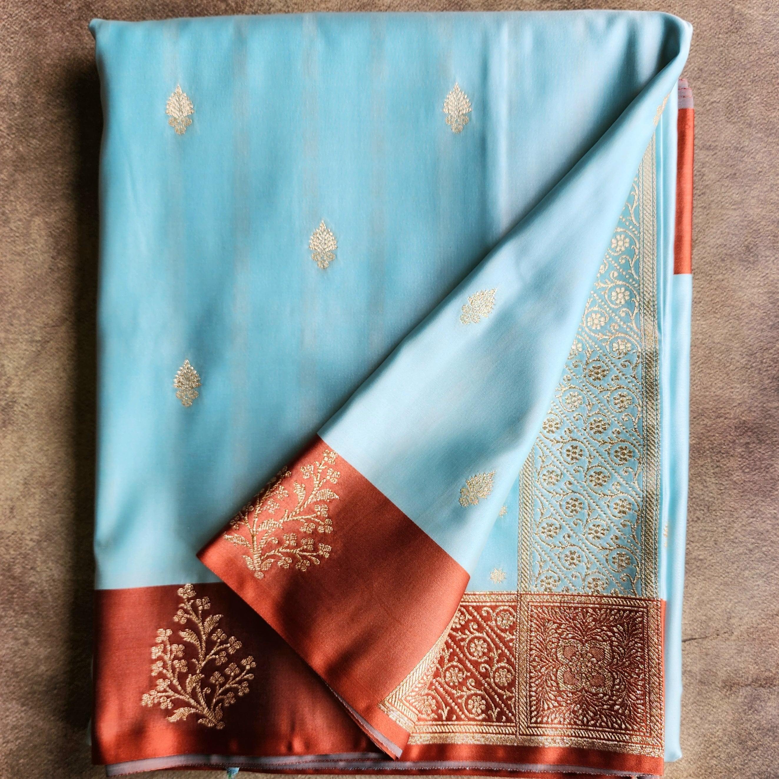 Powder Blue Katan Silk Saree with Rust Orange Gold Zari Border