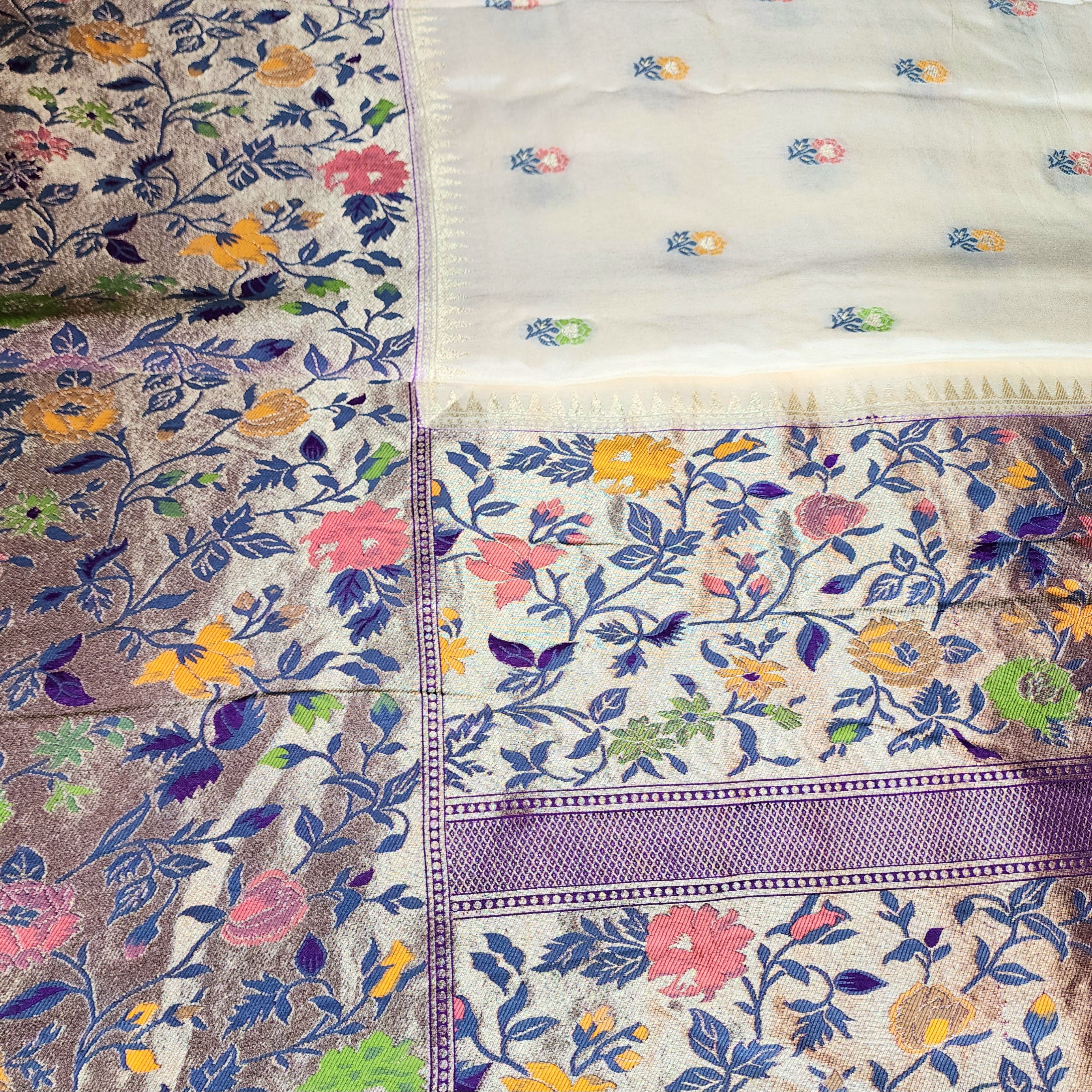 Soft Ivory Raw Silk Saree With Pastel Floral Weaving and Lilac Purple Border