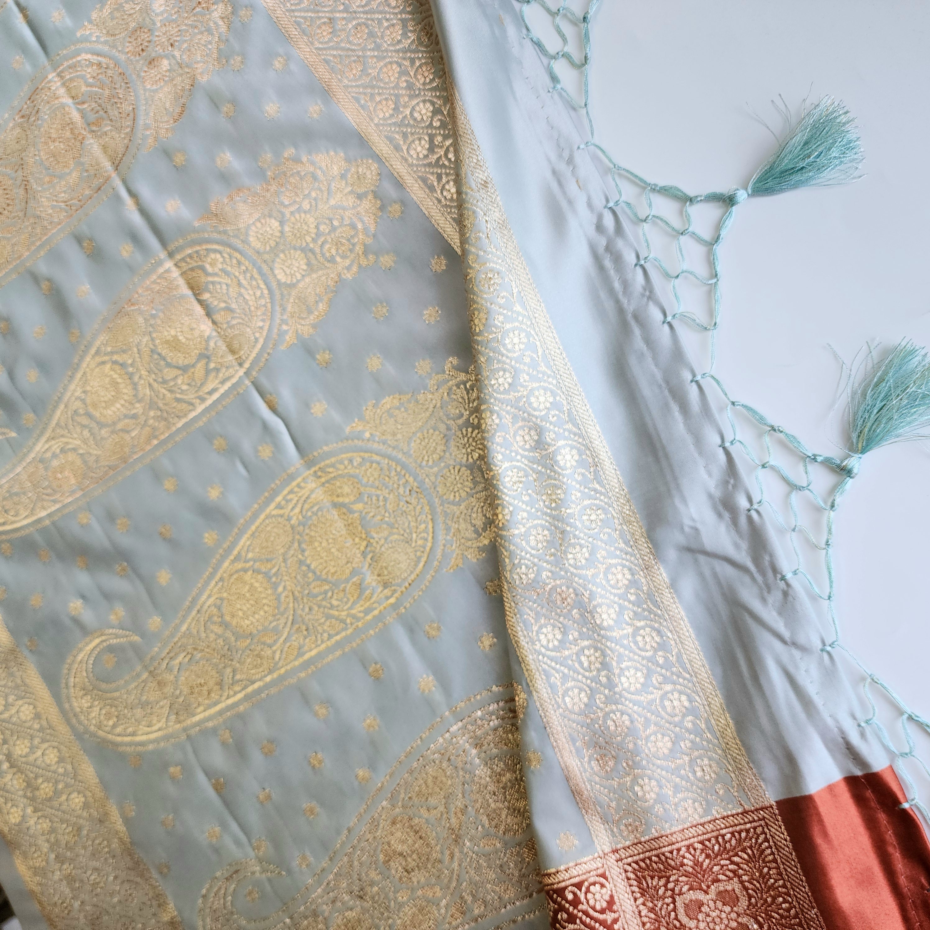 Ice Blue Katan Silk Saree with Peach Beige Gold Zari Border