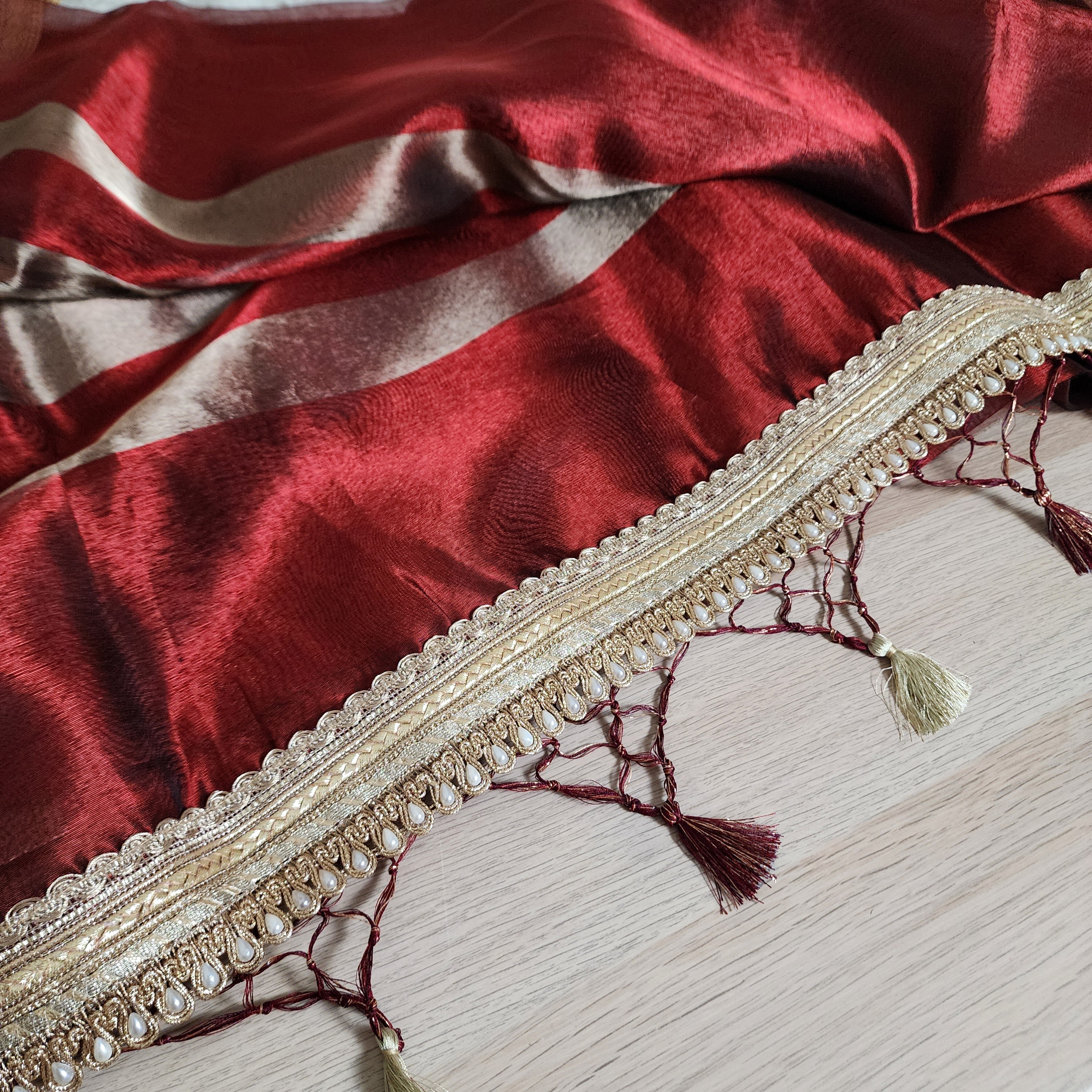 Carmine Red Tissue Silk Saree with beaded lace work