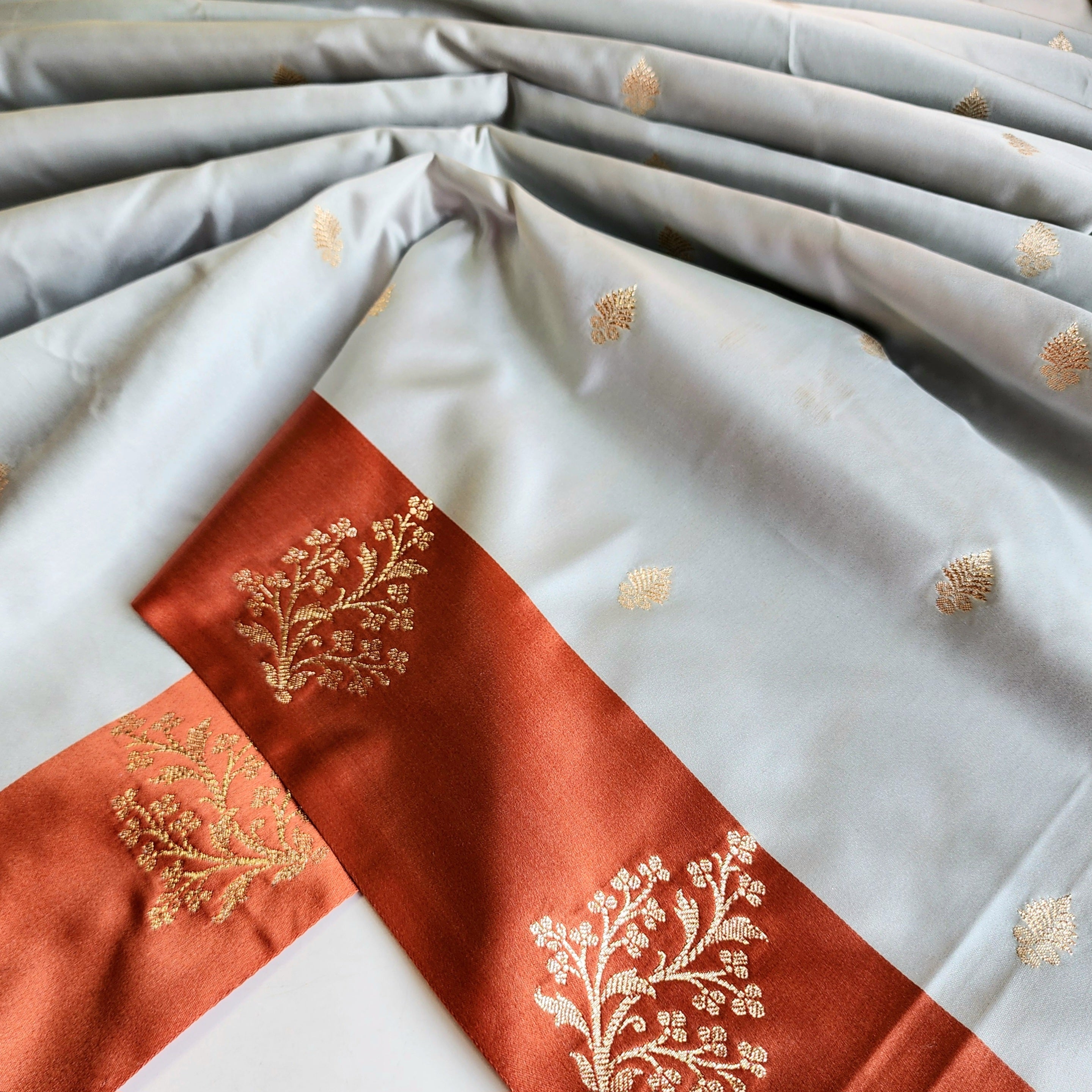 Ice Blue Katan Silk Saree with Peach Beige Gold Zari Border