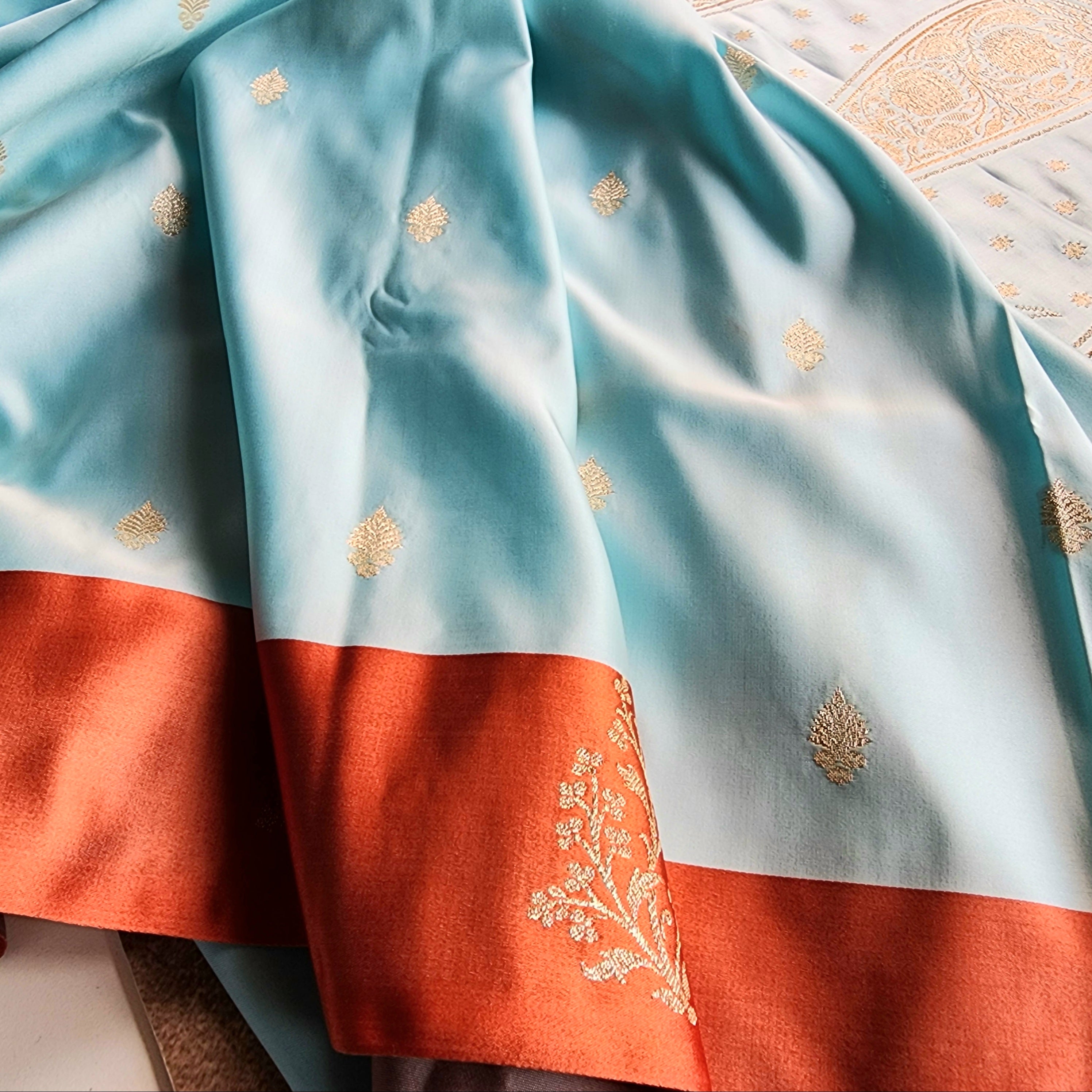 Powder Blue Katan Silk Saree with Rust Orange Gold Zari Border