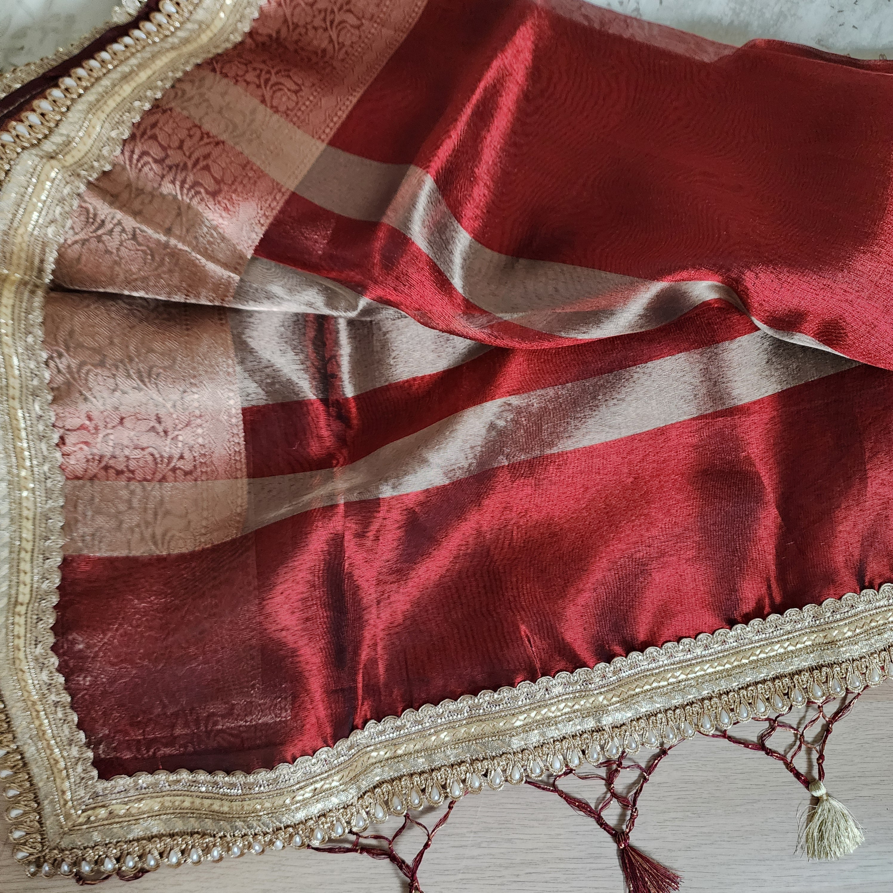 Carmine Red Tissue Silk Saree with beaded lace work