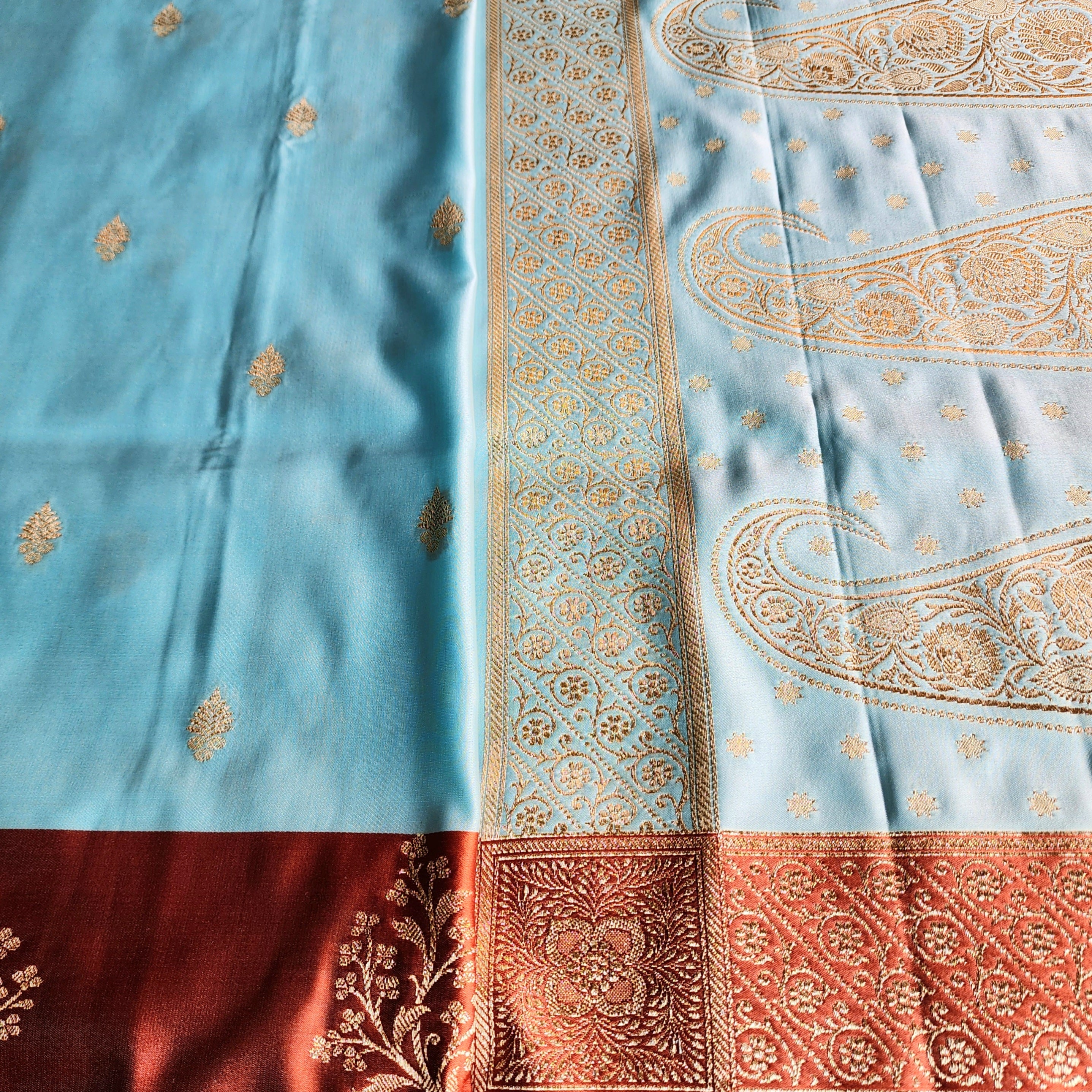 Powder Blue Katan Silk Saree with Rust Orange Gold Zari Border