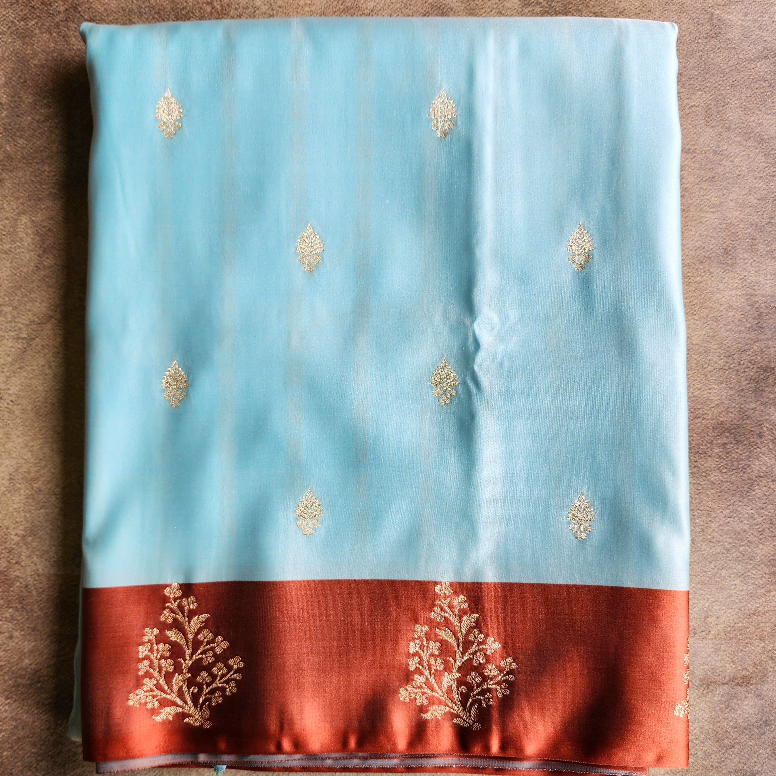 Powder Blue Katan Silk Saree with Rust Orange Gold Zari Border