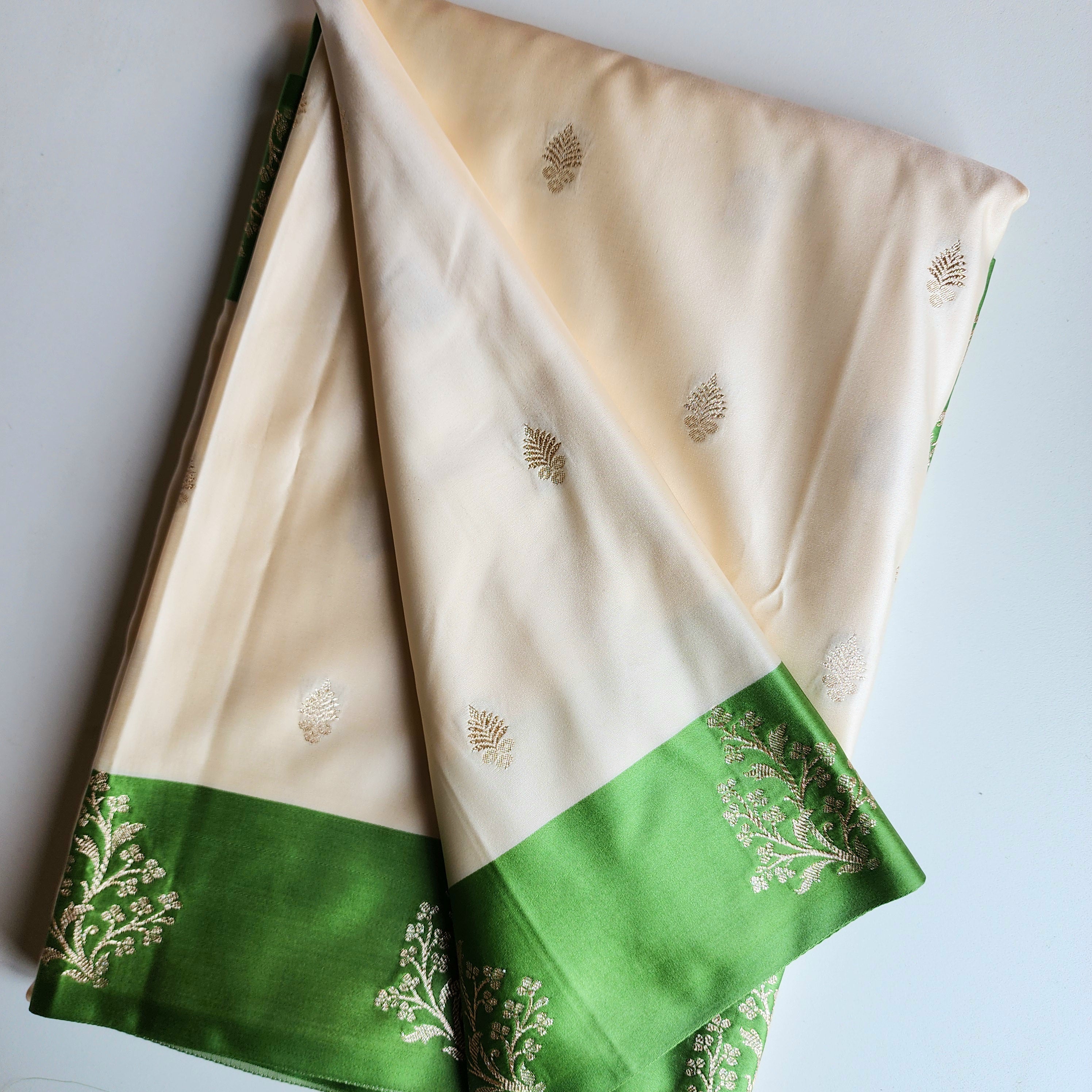 White Katan Silk Saree with Green and Gold Zari Border