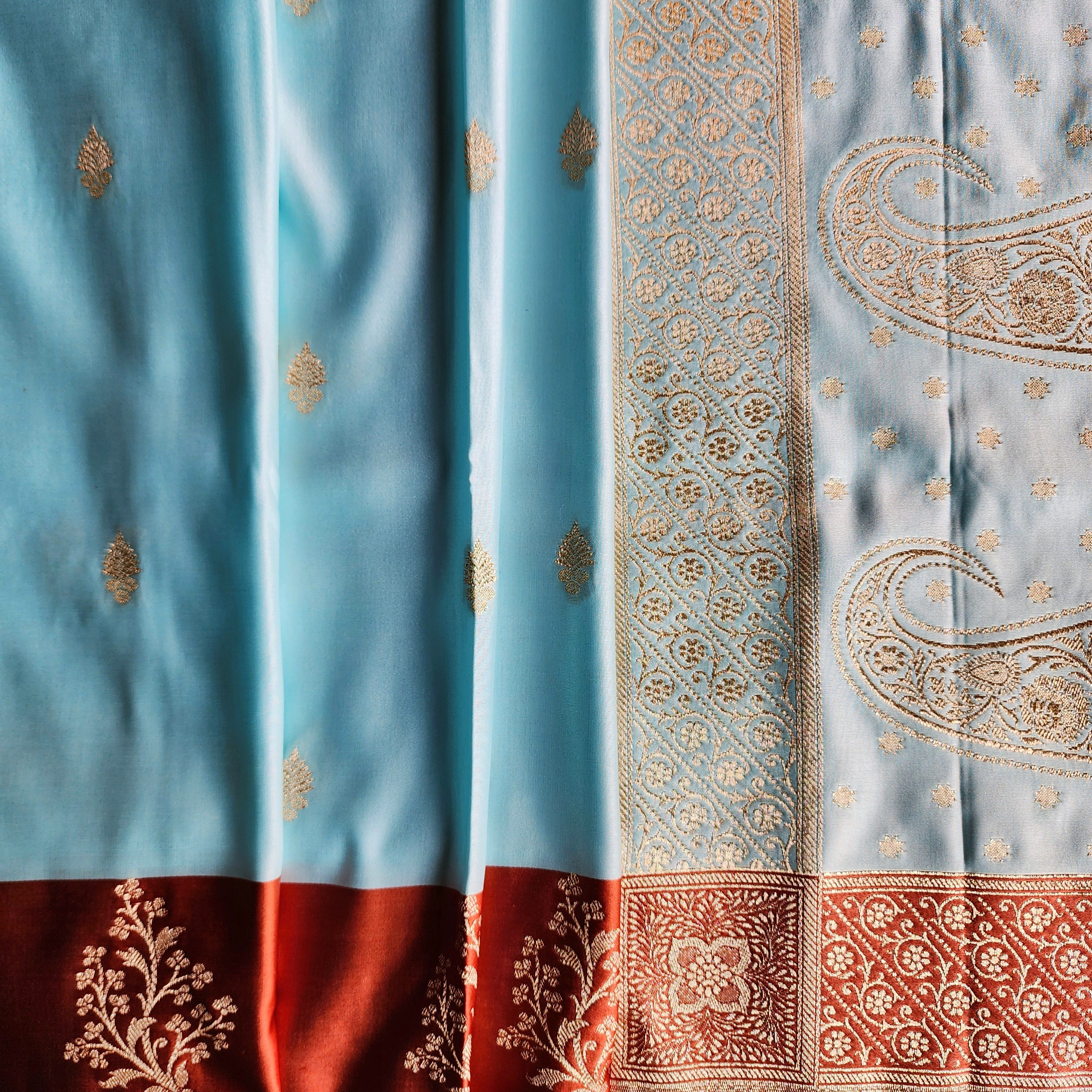 Powder Blue Katan Silk Saree with Rust Orange Gold Zari Border