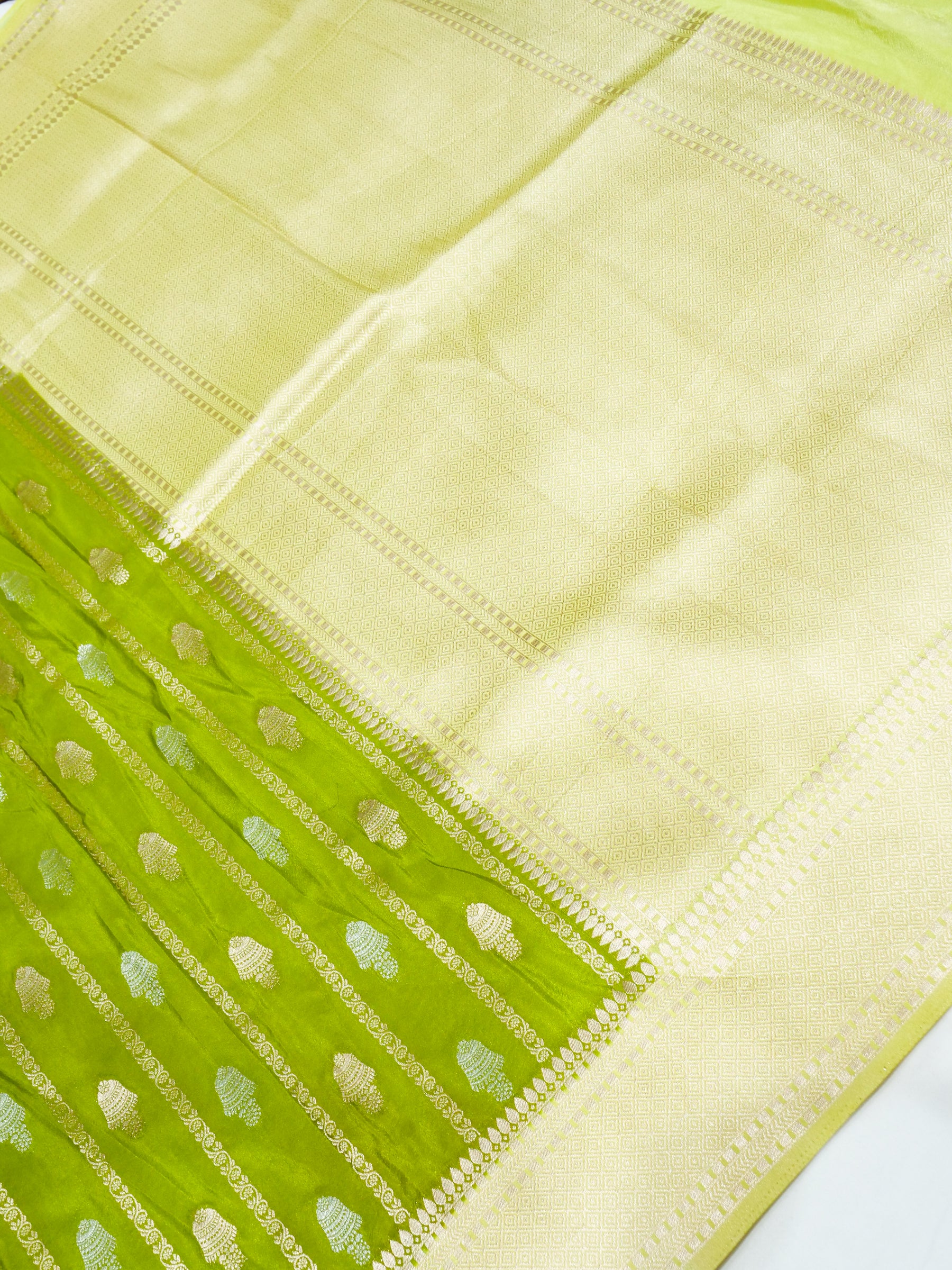 Parrot Green Crepe Georgette Silk Saree with Pale Gold Border