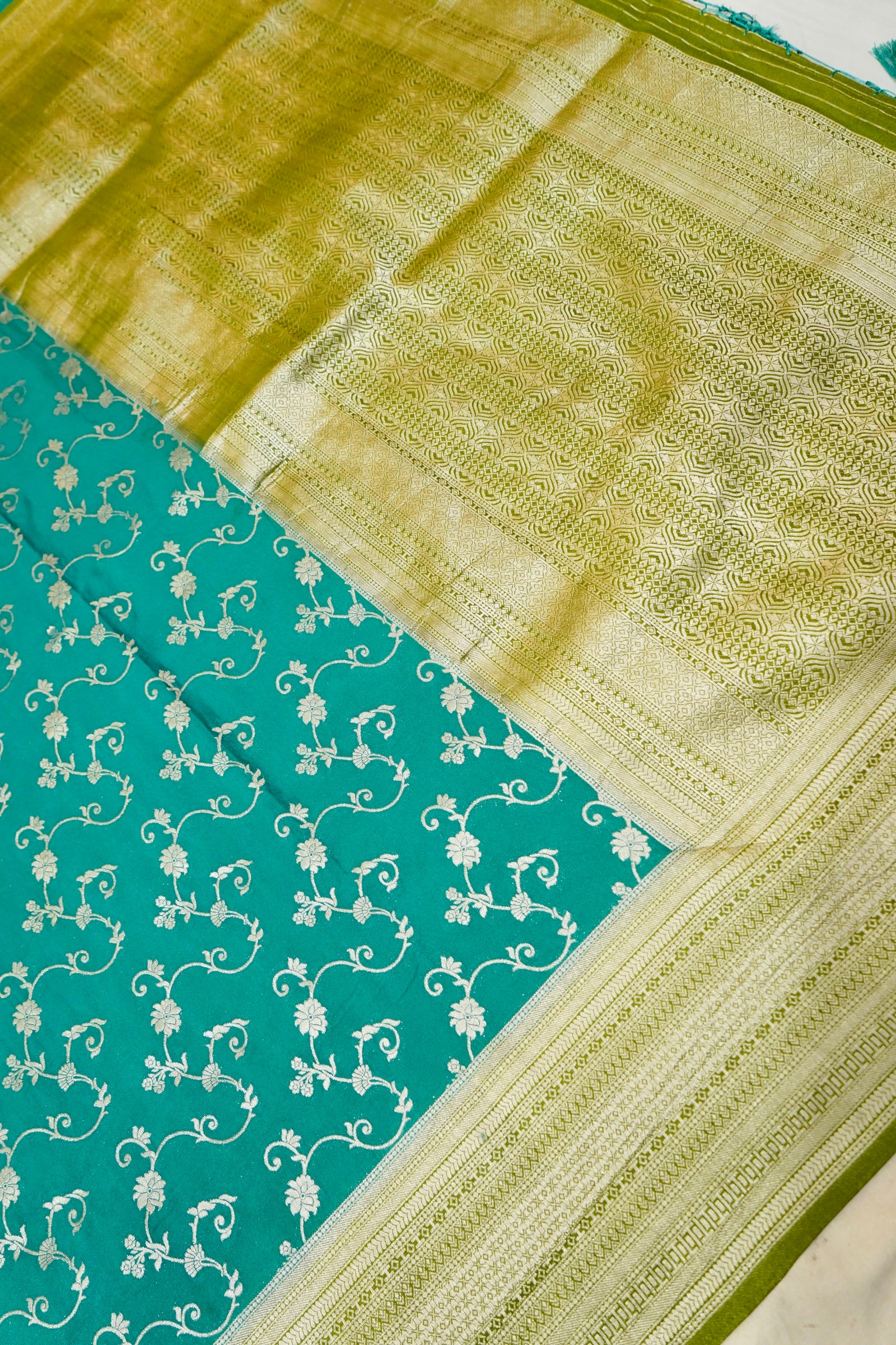 Teal Green Crepe Georgette Silk Saree with Gold Zari Border
