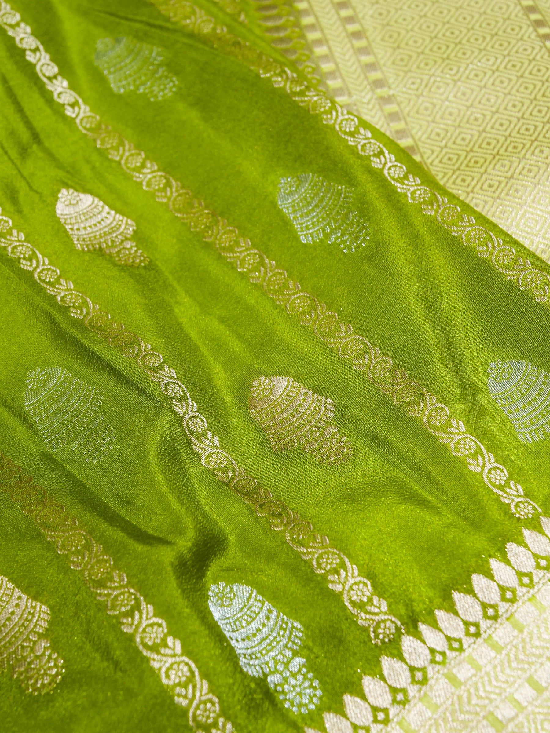 Parrot Green Crepe Georgette Silk Saree with Pale Gold Border