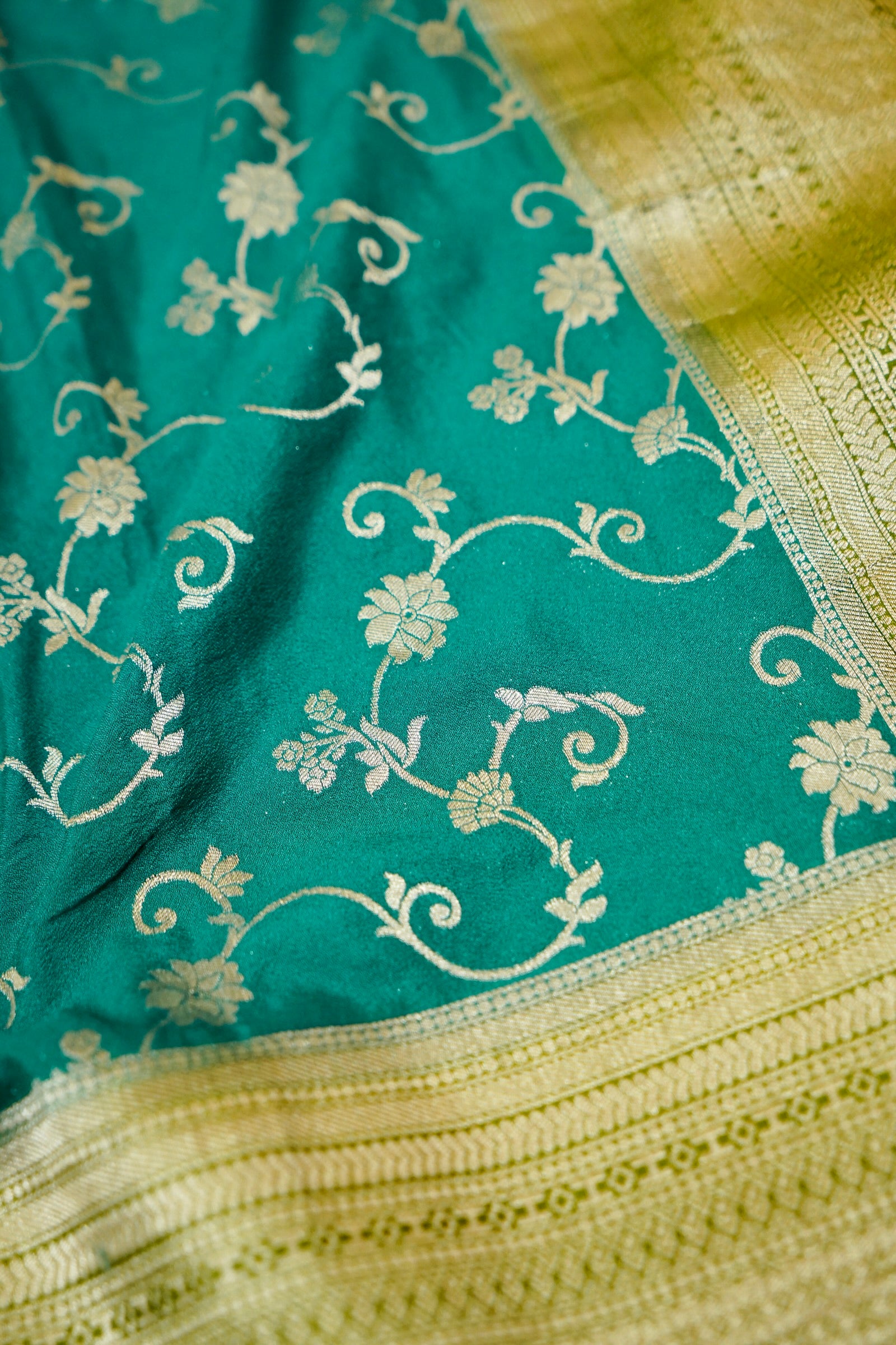 Teal Green Crepe Georgette Silk Saree with Gold Zari Border