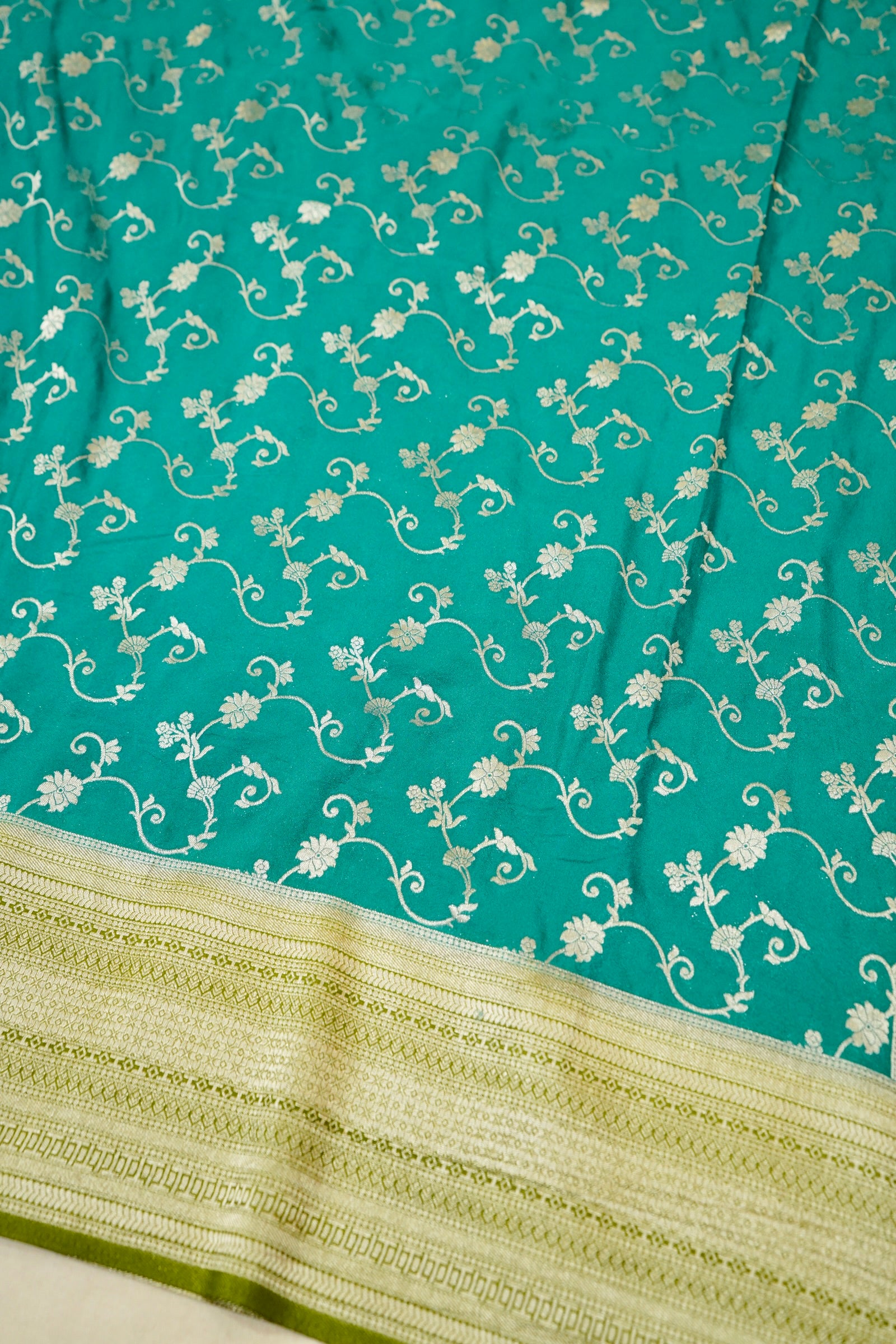 Teal Green Crepe Georgette Silk Saree with Gold Zari Border