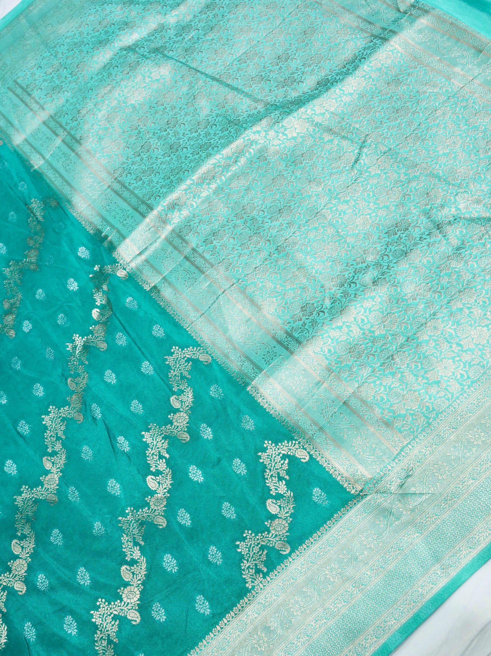 Teal Green Crepe Georgette Silk Saree with Champagne Gold Border