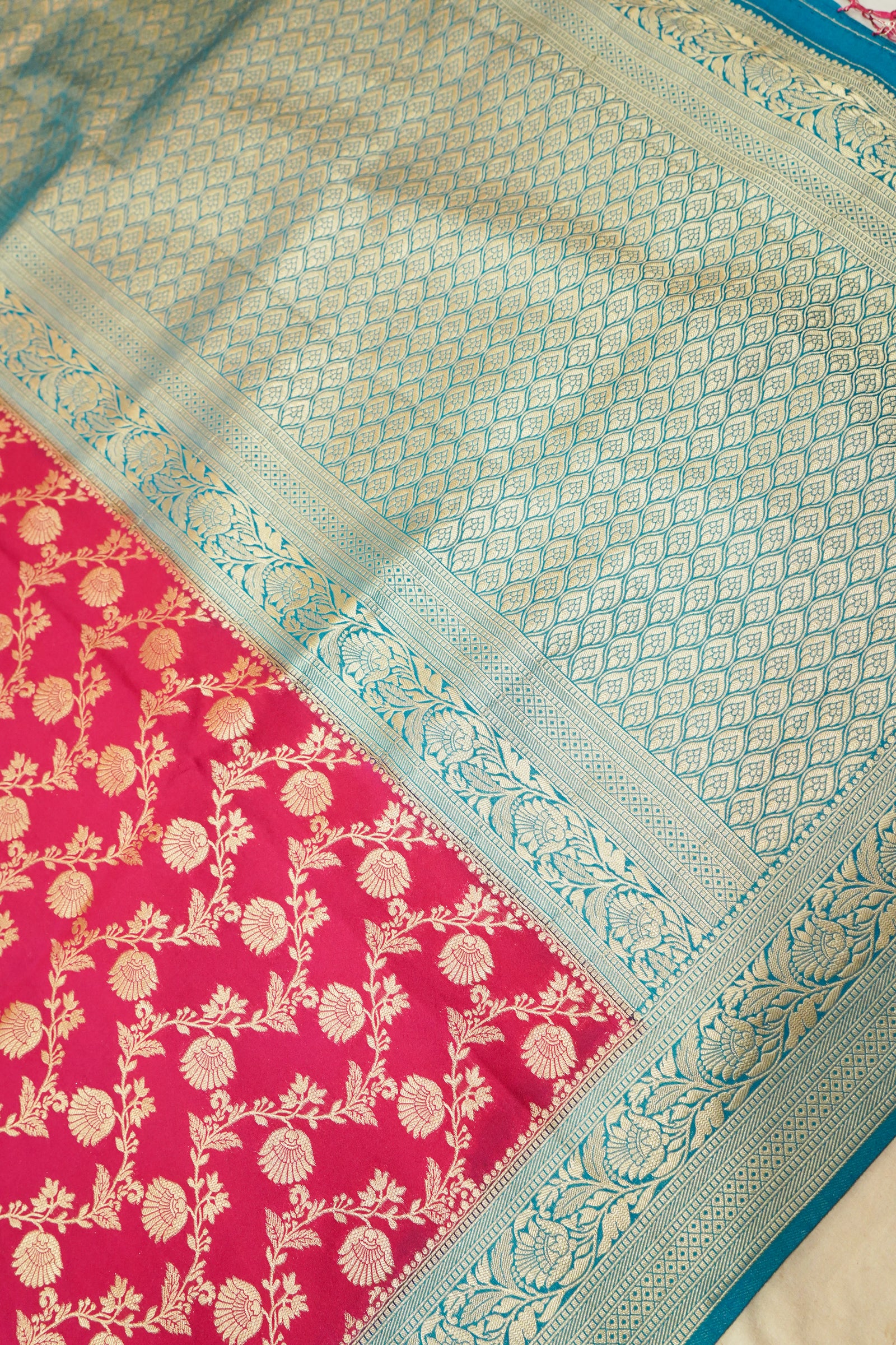 Deep Pink Crepe Georgette Silk Saree with Teal and Gold Zari Border