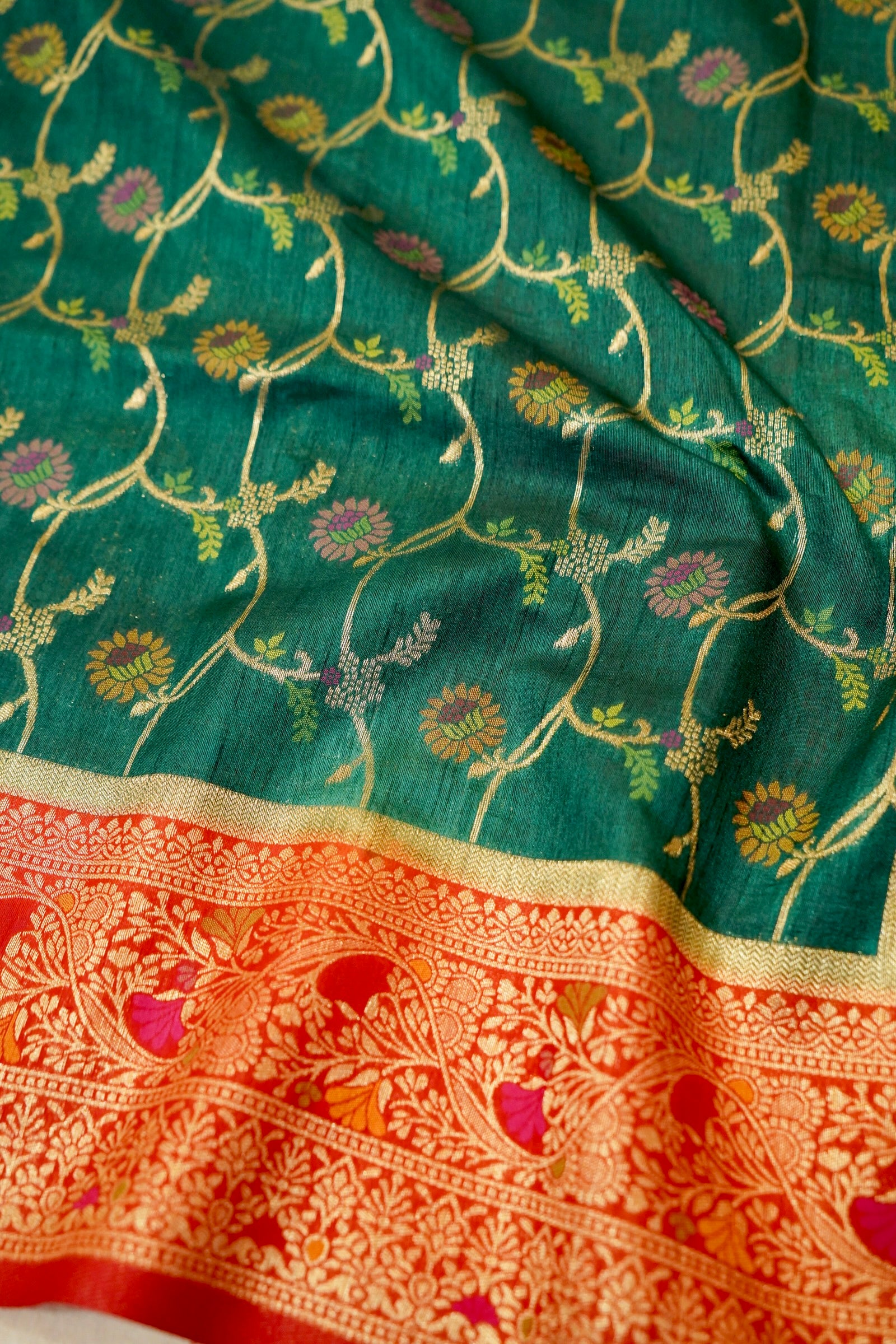 Bottle Green Dupion Patola Saree with Rust-Red Border & Intricate Gold Zari Work
