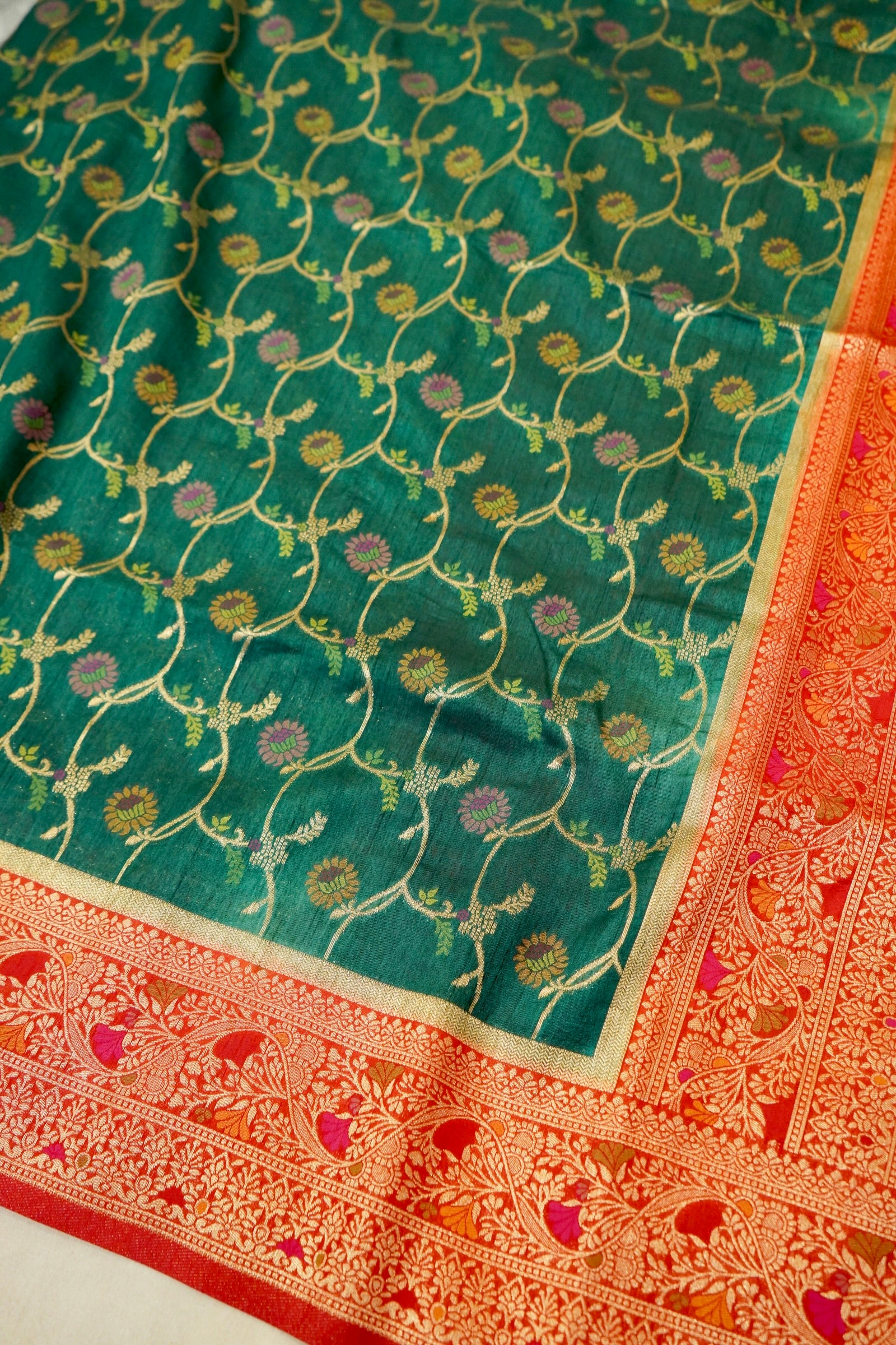 Bottle Green Dupion Patola Saree with Rust-Red Border & Intricate Gold Zari Work