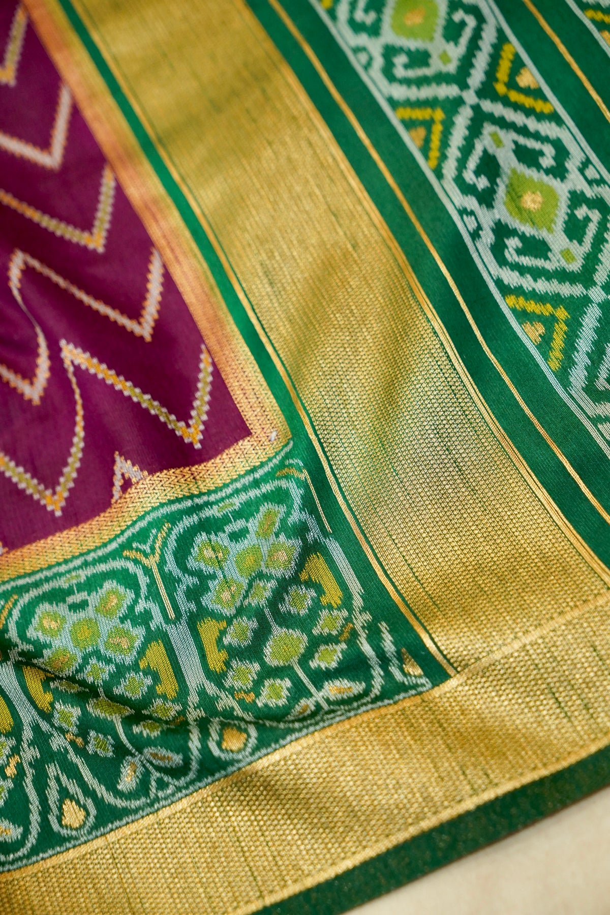 Plum Purple Dupion Patola Saree with Olive-Gold Border & Geometric Ikat Pattern