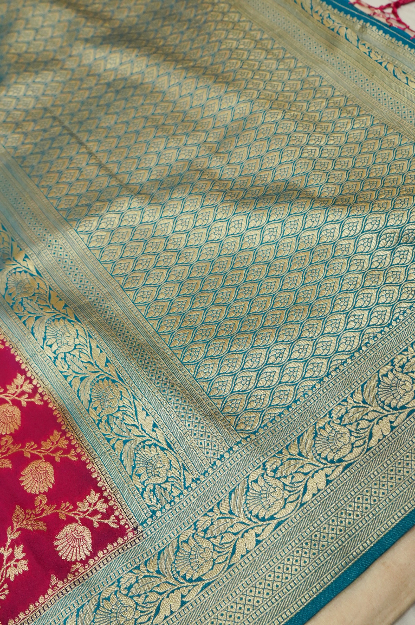 Deep Pink Crepe Georgette Silk Saree with Teal and Gold Zari Border