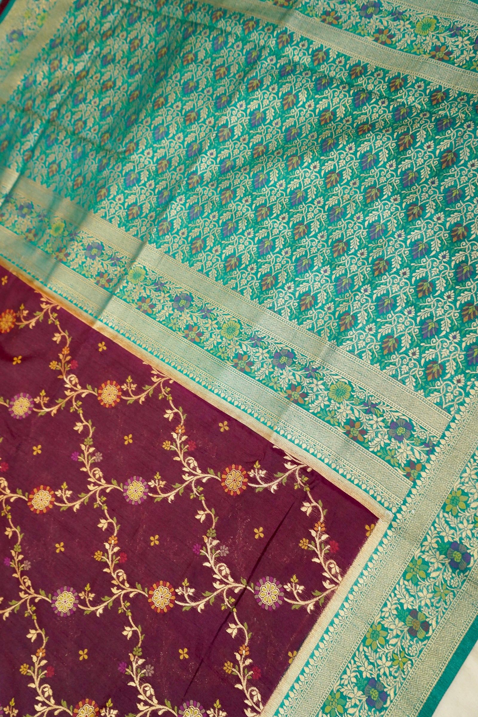 Wine Purple Dupion Patola Saree with Mint Green Border & Delicate Gold Zari Motifs
