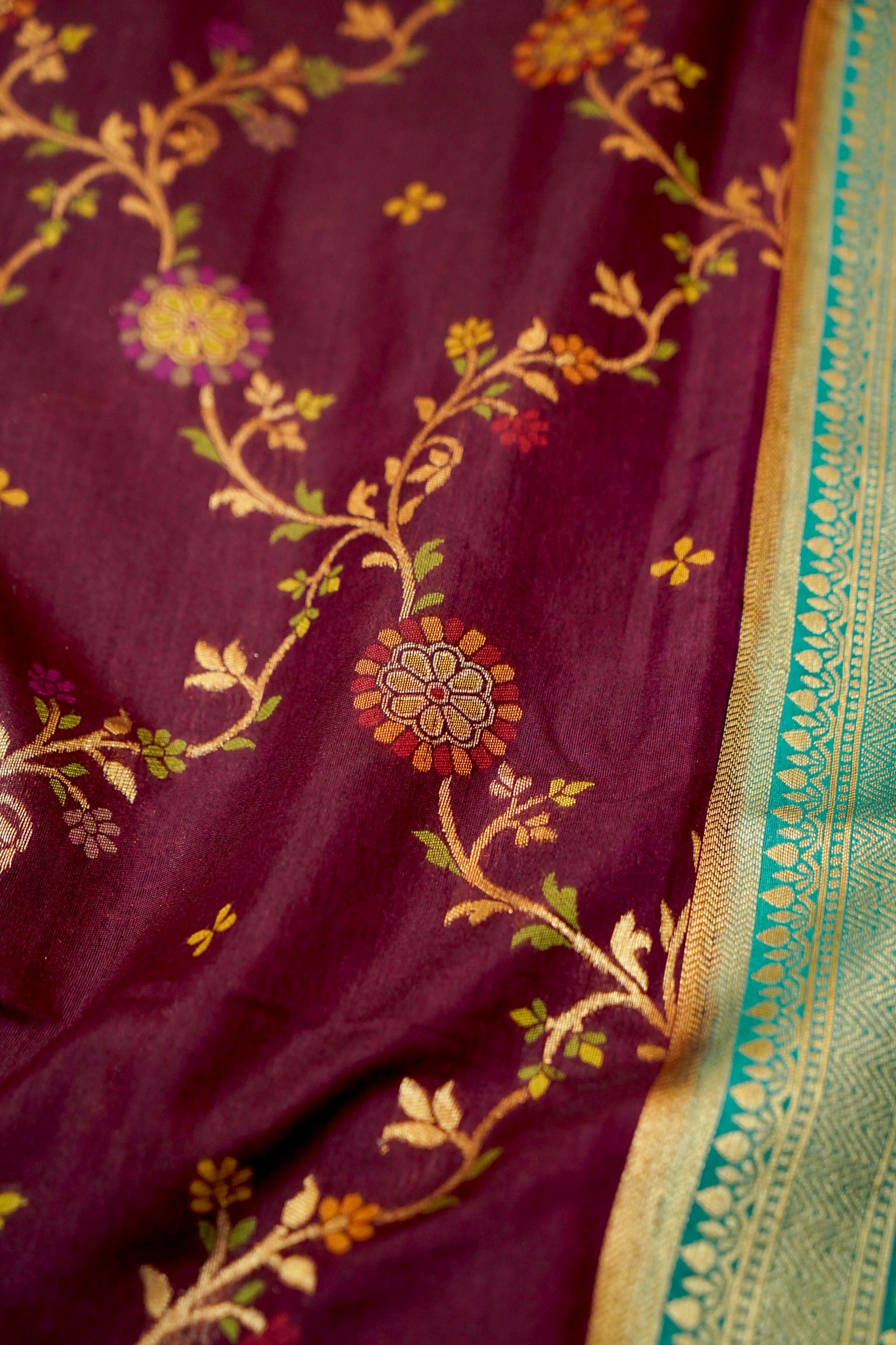 Wine Purple Dupion Patola Saree with Mint Green Border & Delicate Gold Zari Motifs