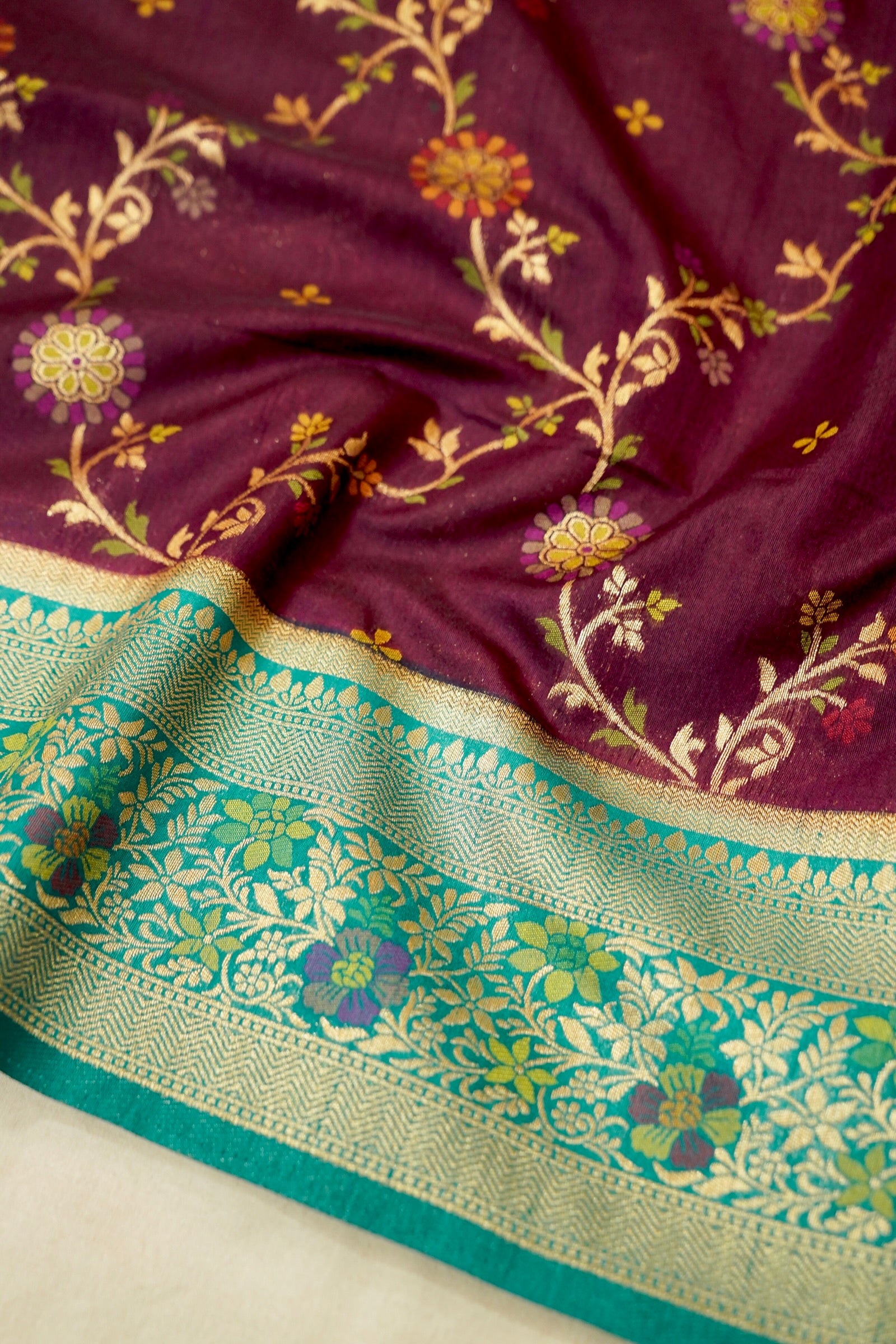 Wine Purple Dupion Patola Saree with Mint Green Border & Delicate Gold Zari Motifs