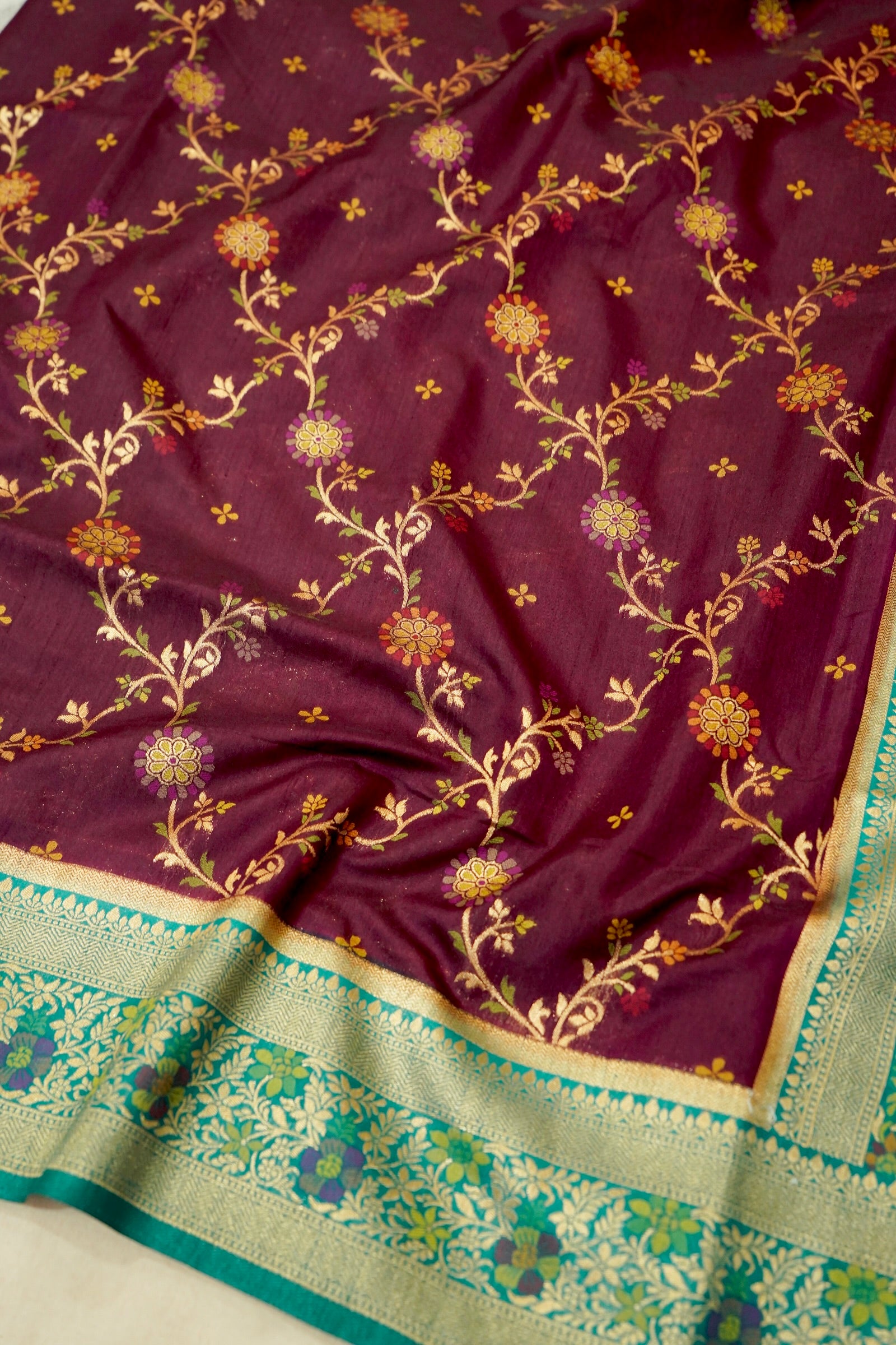 Wine Purple Dupion Patola Saree with Mint Green Border & Delicate Gold Zari Motifs