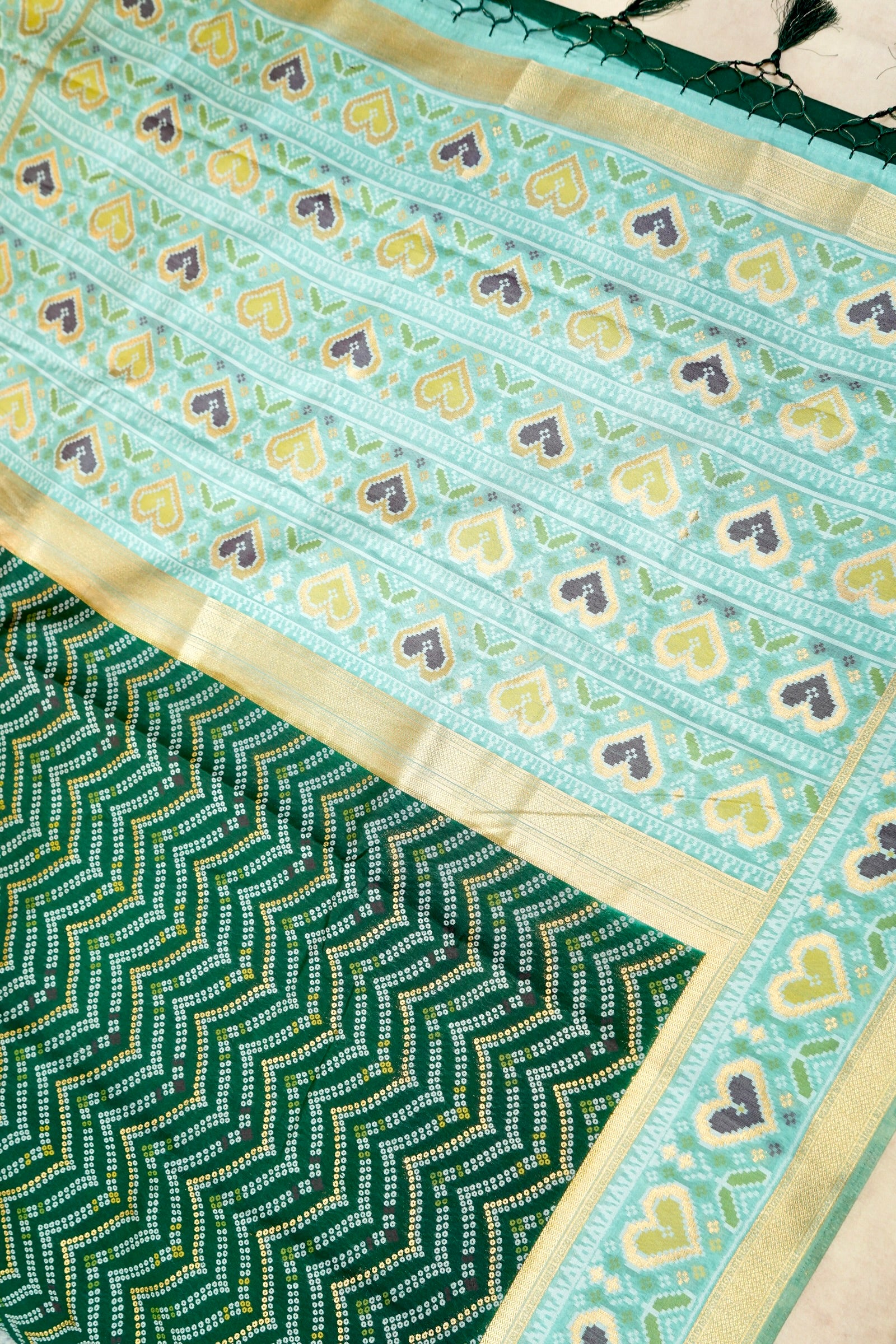 Bottle Green Ikkat Patola Silk Saree with Mint Green Border