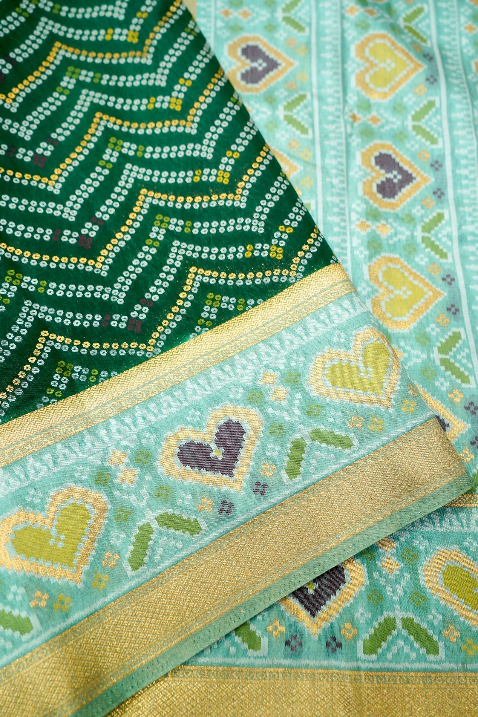 Bottle Green Ikkat Patola Silk Saree with Mint Green Border