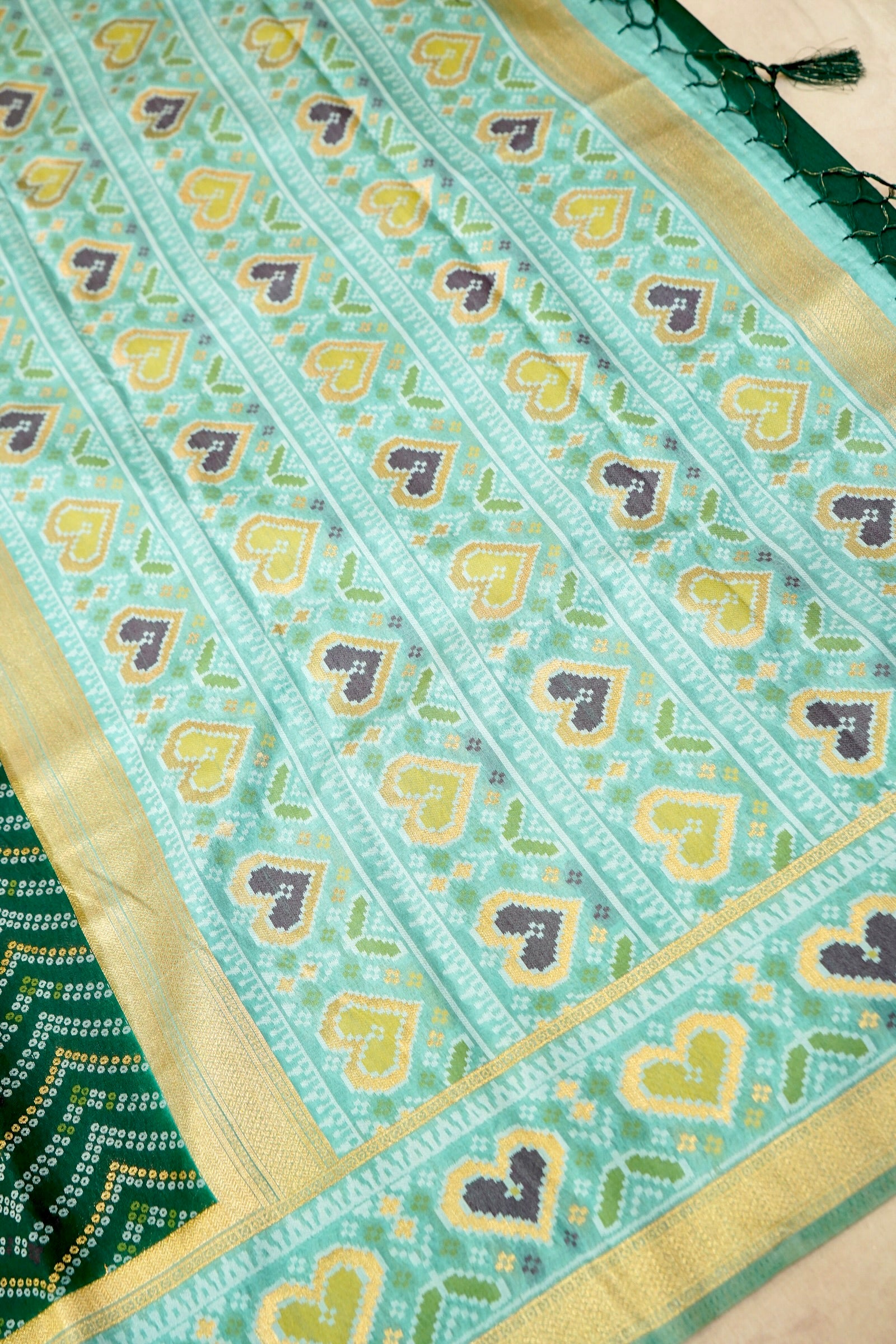 Bottle Green Ikkat Patola Silk Saree with Mint Green Border