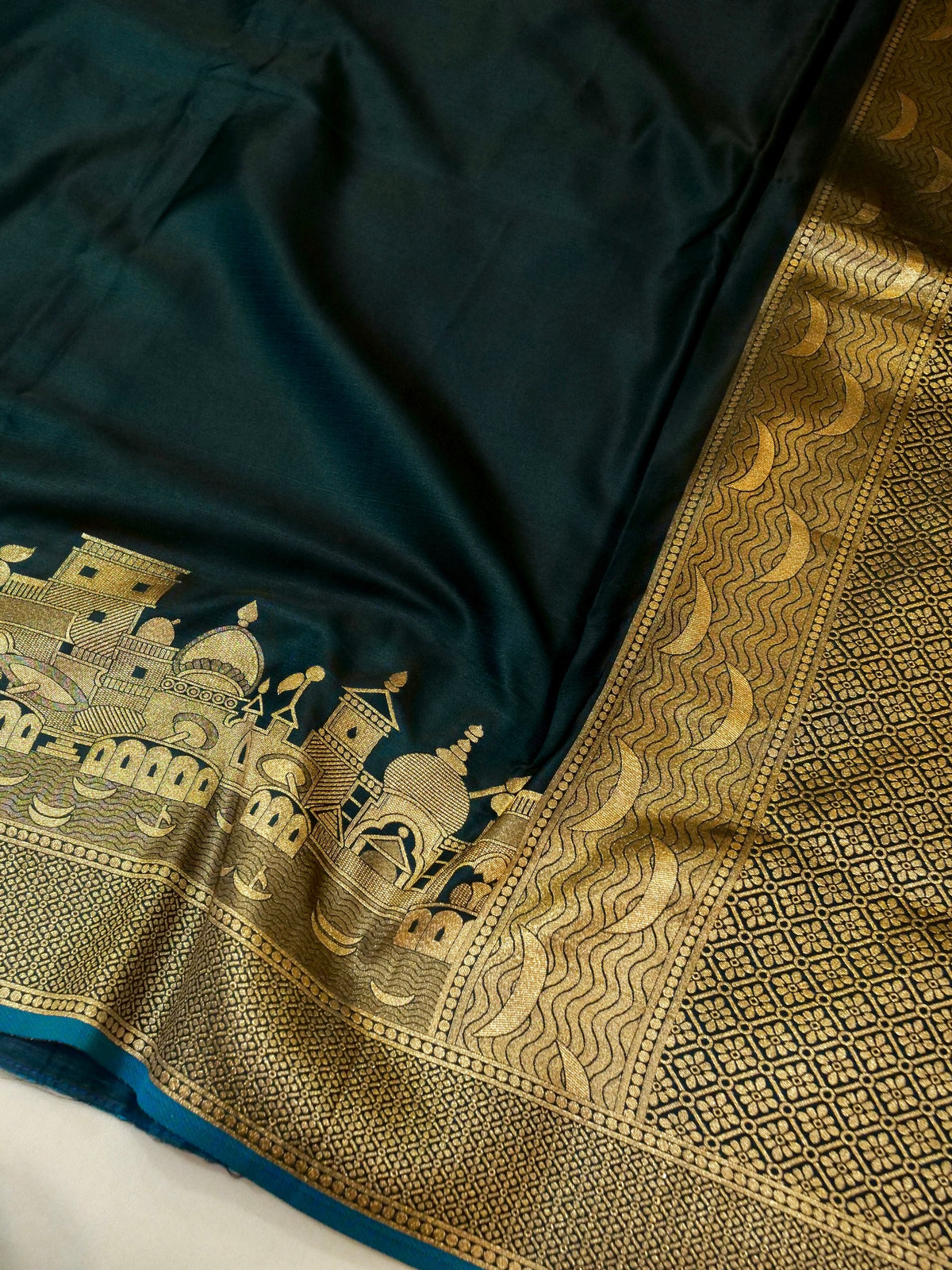 Nihar - Deep Teal Blue Ghat Border Banarasi Silk Saree with Stitched Blouse