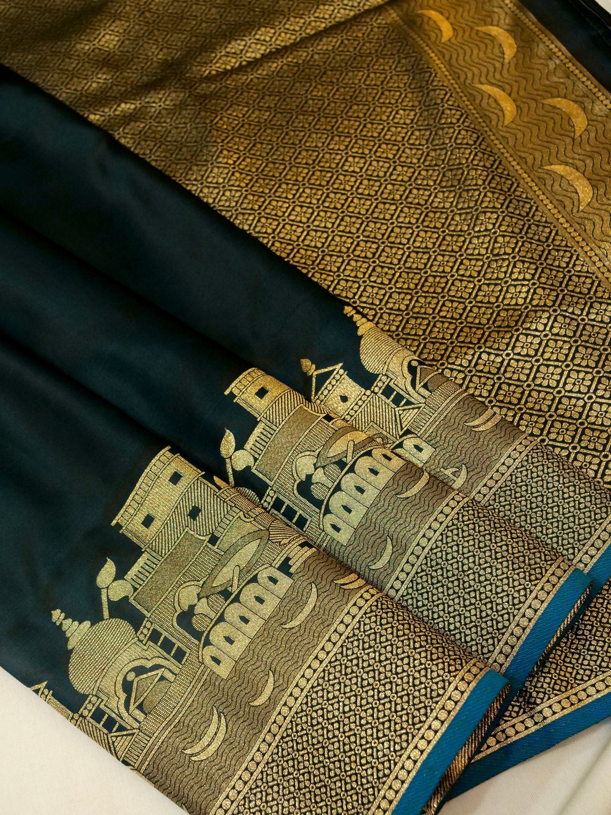 Nihar - Deep Teal Blue Ghat Border Banarasi Silk Saree with Stitched Blouse