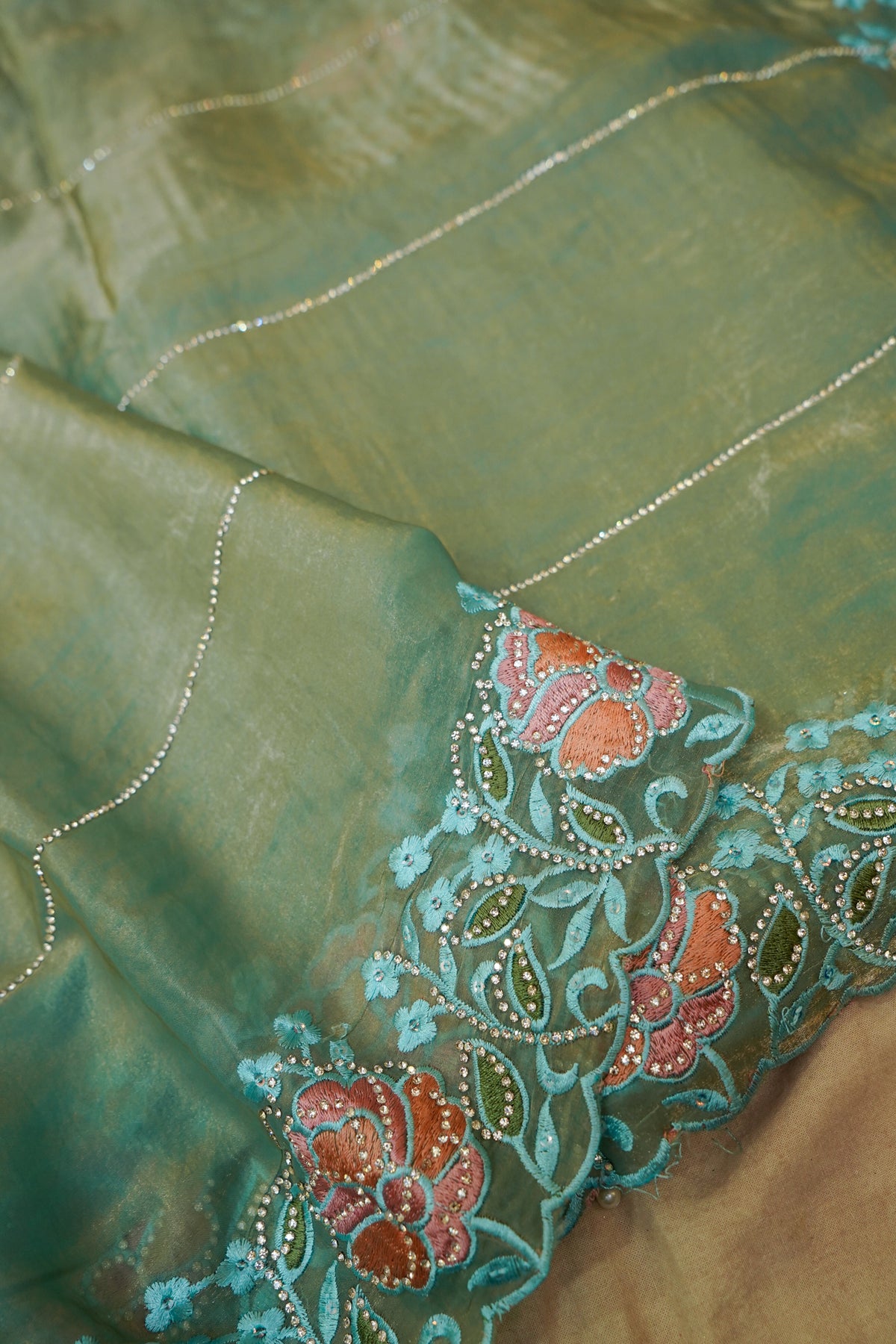 Aqua Blue Camellia Bloom Designer Tissue Saree with Rhinestone
