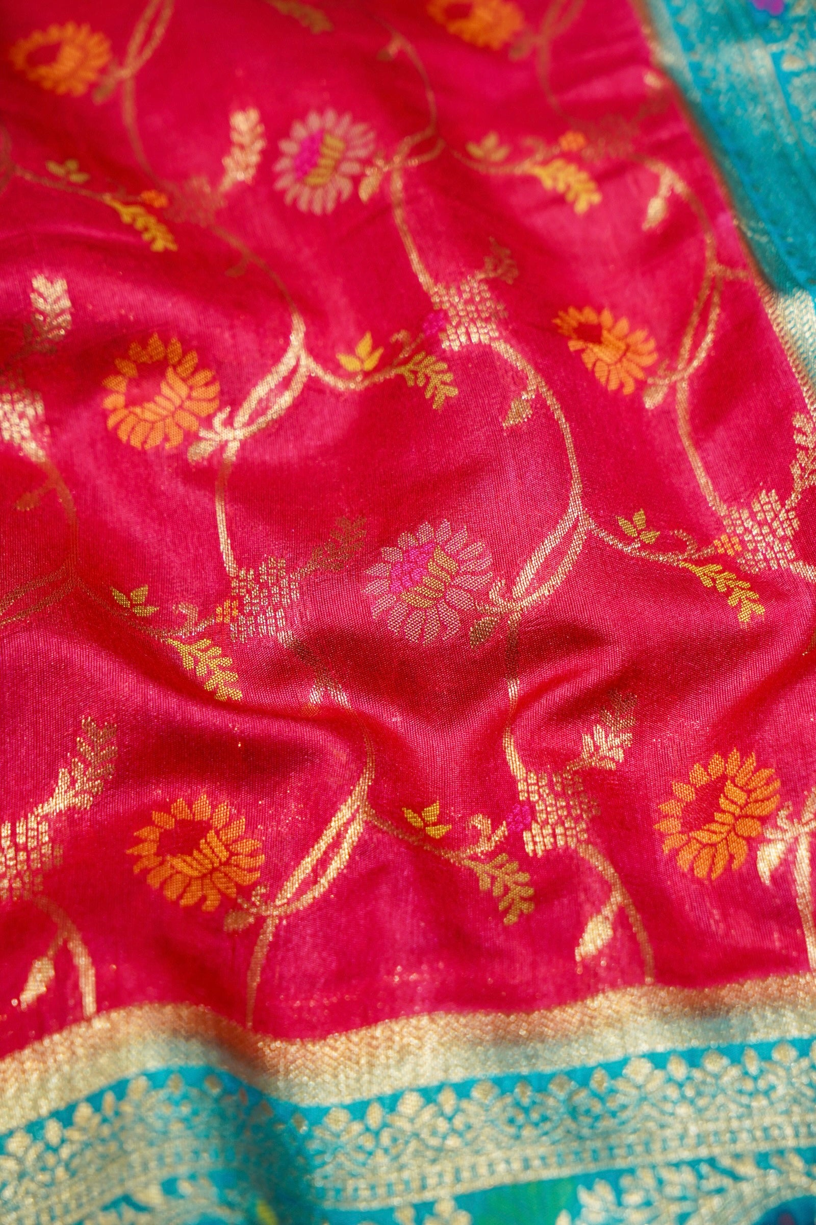 Ruby Pink Ikkat Patola Silk Saree with Turquoise Blue Border