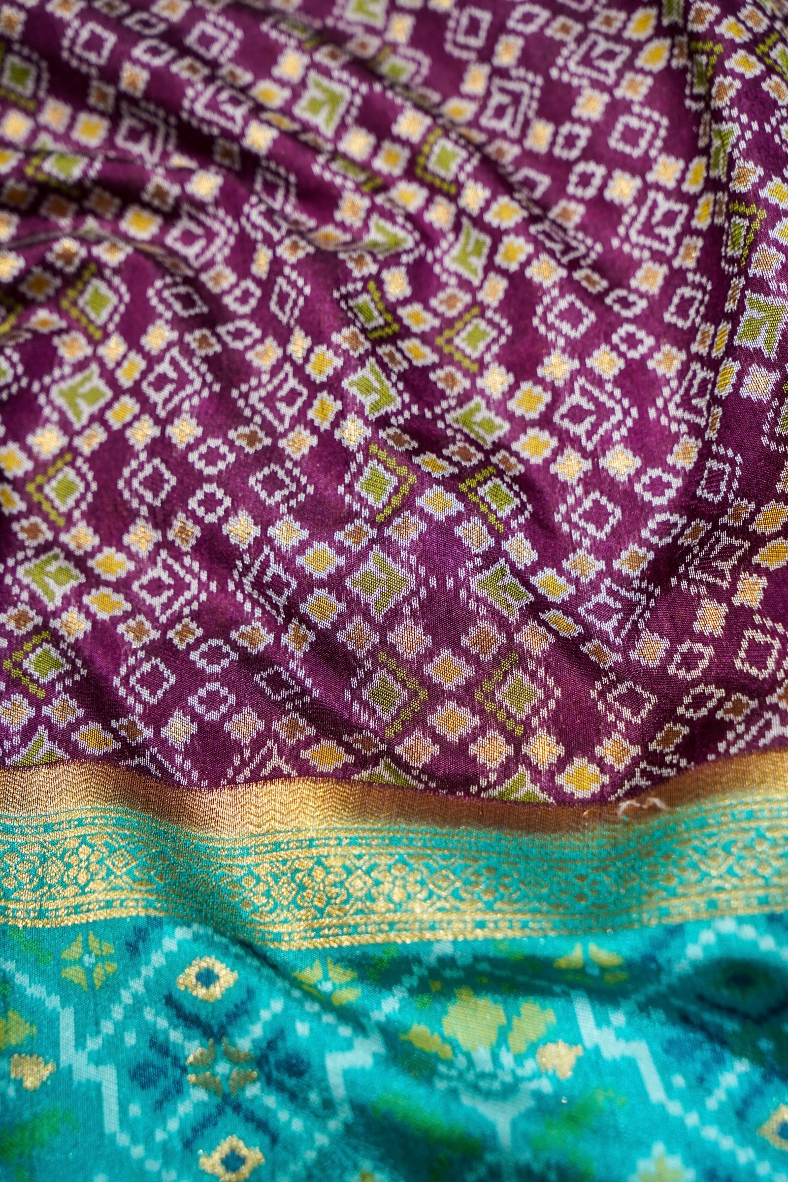 Wine Purple Ikkat Patola Silk Saree with Turquoise Blue Border
