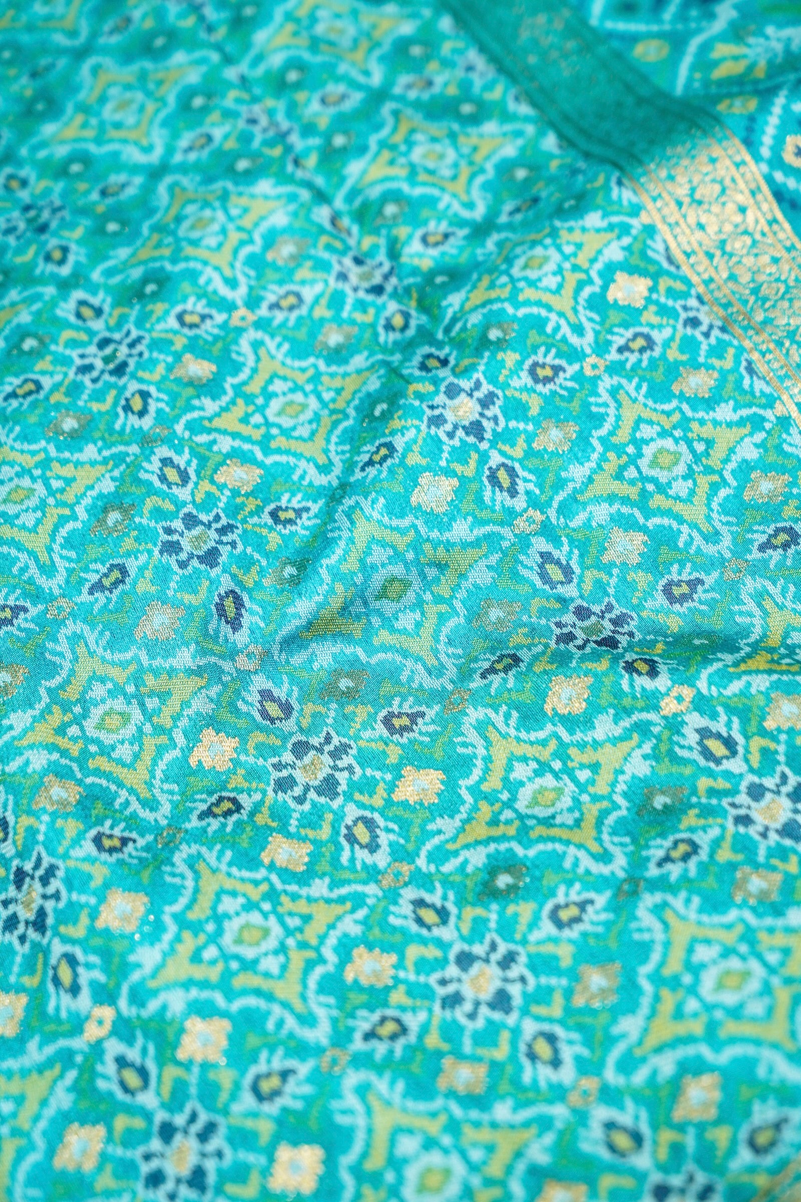 Wine Purple Ikkat Patola Silk Saree with Turquoise Blue Border