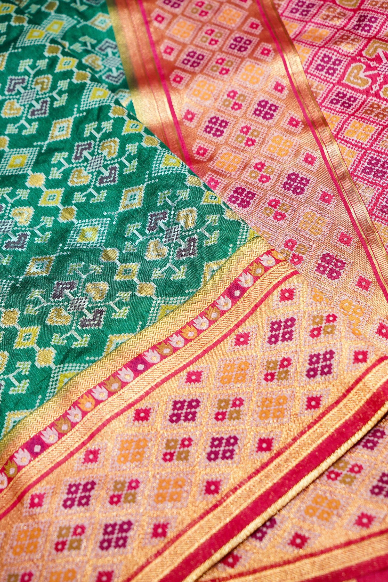 Bottle Green Ikkat Patola Silk Saree with Blush Pink Border