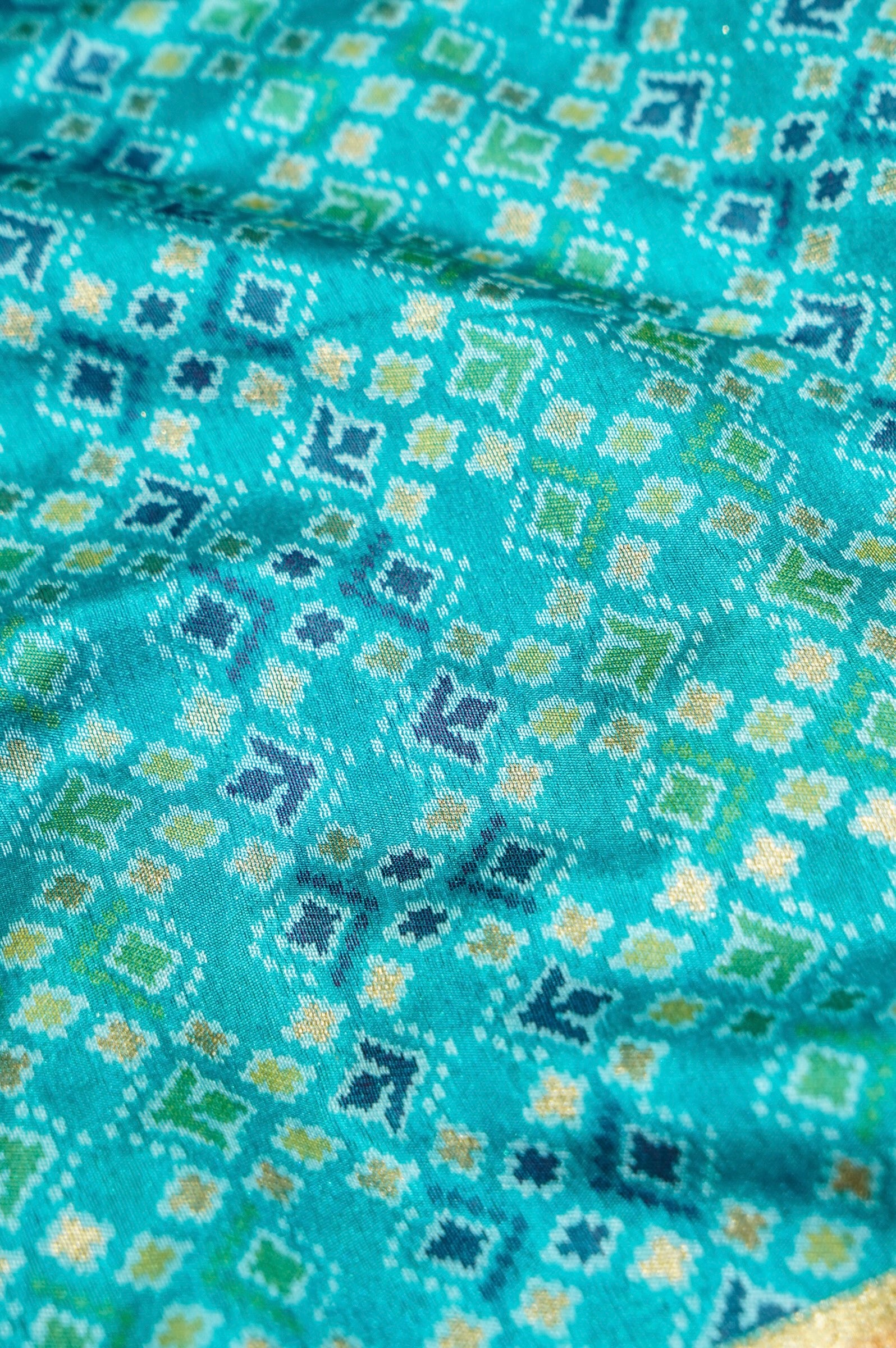 Aqua Blue Ikkat Patola Silk Saree with Rani Pink Border