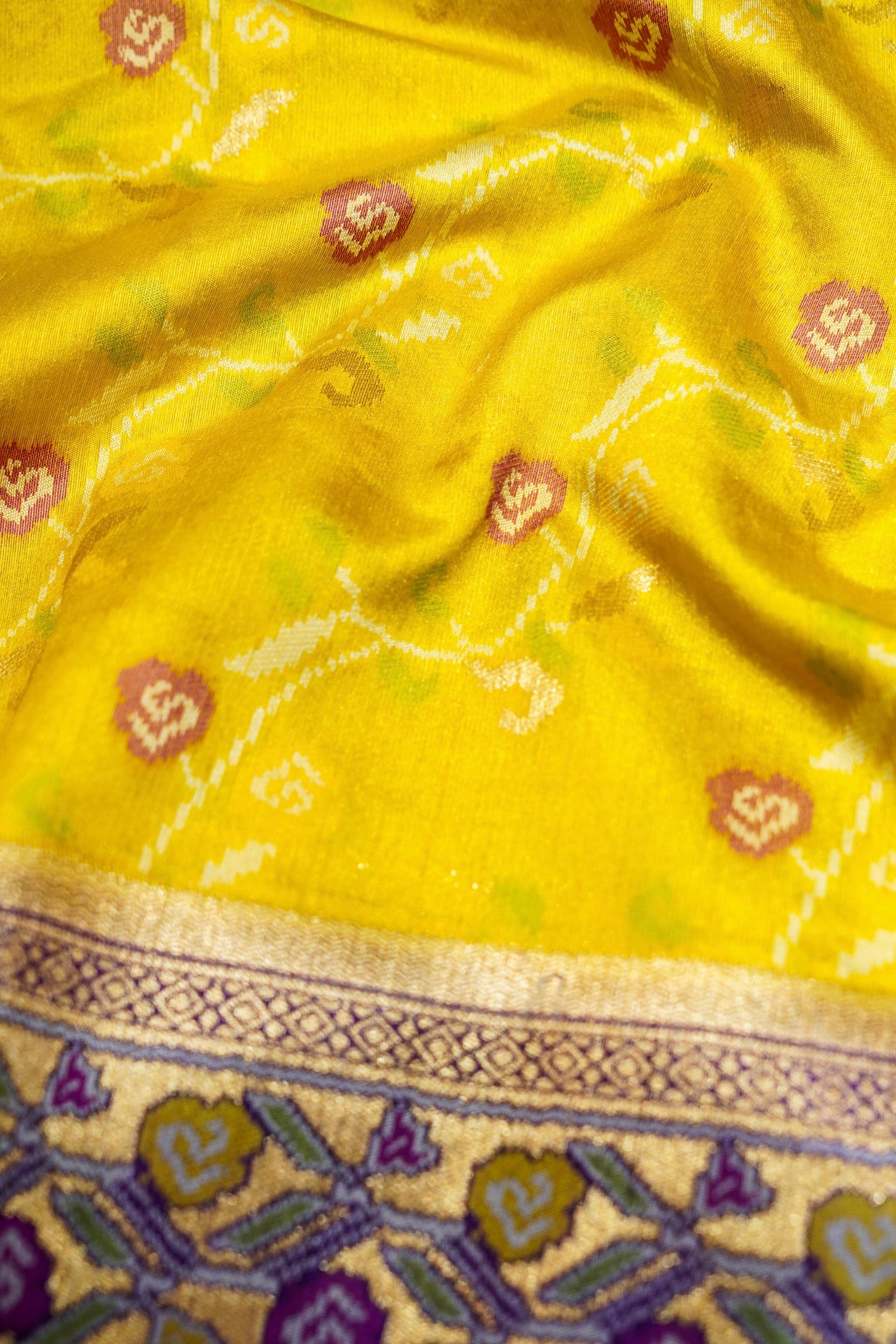 Sunshine Yellow Ikkat Patola Silk Saree with Violet Border