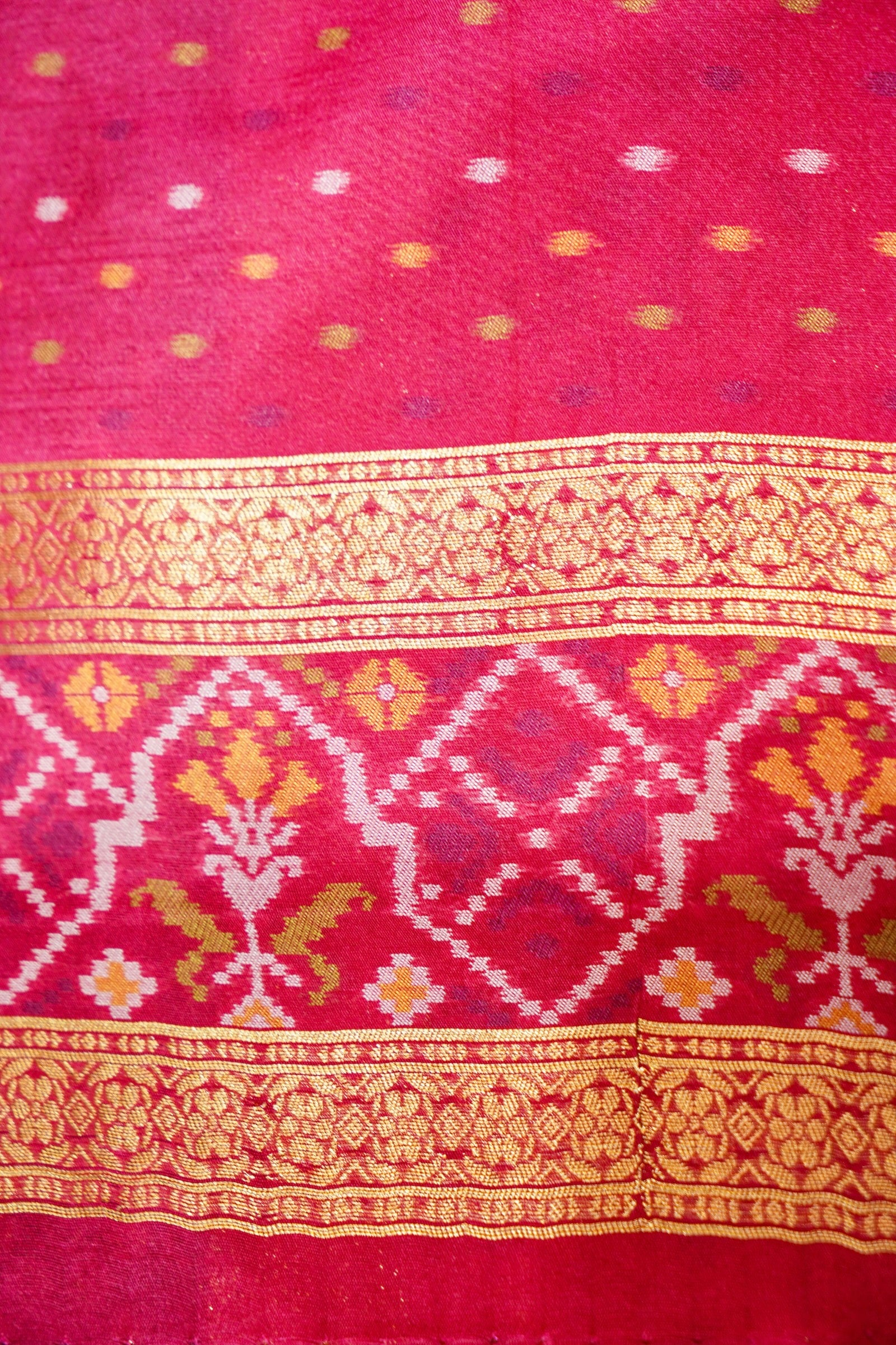 Emerald Green Ikkat Patola Silk Saree with Rani Pink Border