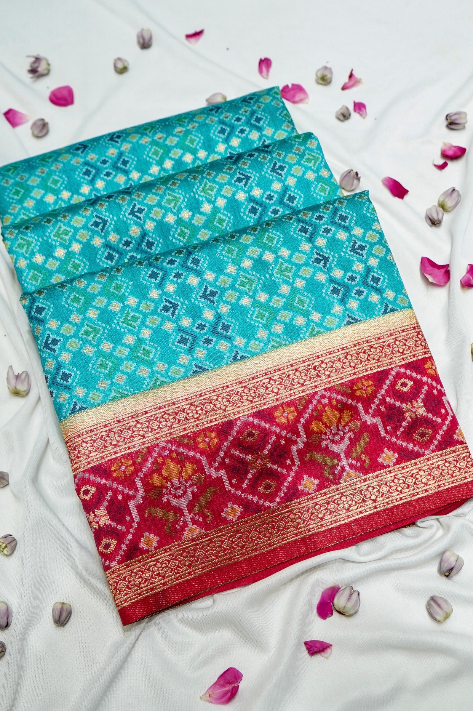 Aqua Blue Ikkat Patola Silk Saree with Rani Pink Border
